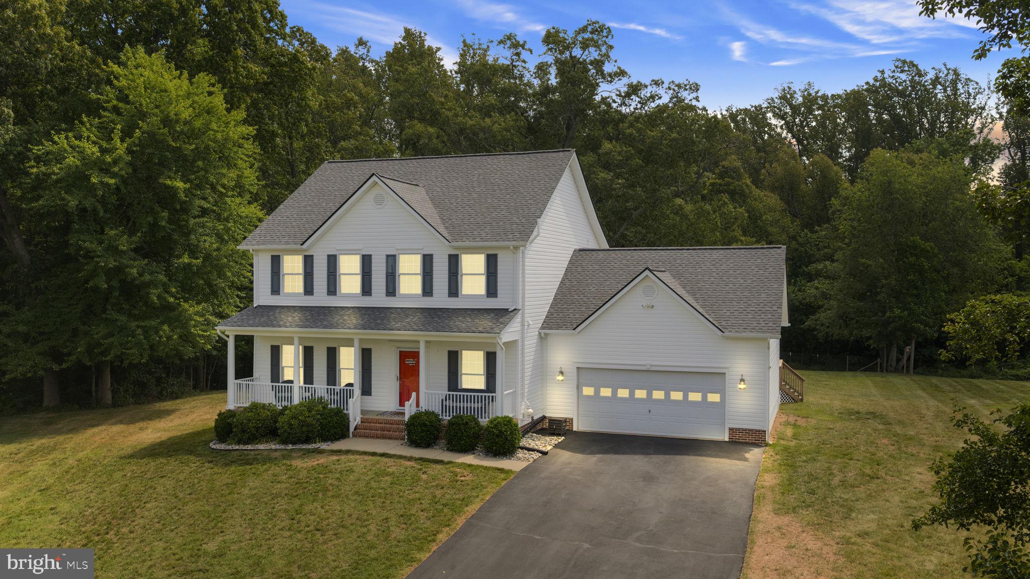 Welcome home to 143 Greenway Street, located in sought-after Falmouth, VA! This beautifully maintained, one-owner home is perfectly situated on a quiet cul-de-sac and offers the ideal blend of comfort, space, and functionality. As you arrive, you'll be greeted by the inviting covered front porch, perfect for relaxing and enjoying a cup of coffee. Step inside to discover an open and welcoming floor plan designed for both everyday living and entertaining. The dining room, living room with a gas fireplace, and kitchen flow seamlessly together, creating a bright and spacious gathering area. The kitchen features a cooktop, wall oven, built-in microwave, abundant cabinet space, a breakfast nook, and a breakfast bar that provides additional seating. Just off the living room, you'll find a large screened-in porch and expansive deck, the perfect setting for outdoor entertaining, family gatherings, or simply enjoying the flat backyard. The main level also includes an oversized two-car garage and a full bathroom. Upstairs, the spacious primary suite serves as a relaxing retreat, complete with a private bath featuring a dual-sink vanity, a large soaking tub, and a walk-in closet with built-in shelving. Two additional generously sized bedrooms and a full hall bathroom complete the upper level. The finished basement provides even more living space with a large family room featuring built-in shelving, a full bathroom, and an additional room with a closet currently used as a bedroom (not to code). An unfinished storage room offers plenty of space for seasonal items, tools, and extra belongings. Major updates include a new roof, siding, and gutters, all replaced within the last 5 years. Schedule your showing today—you don't want to miss the opportunity to make this exceptional house your new home!