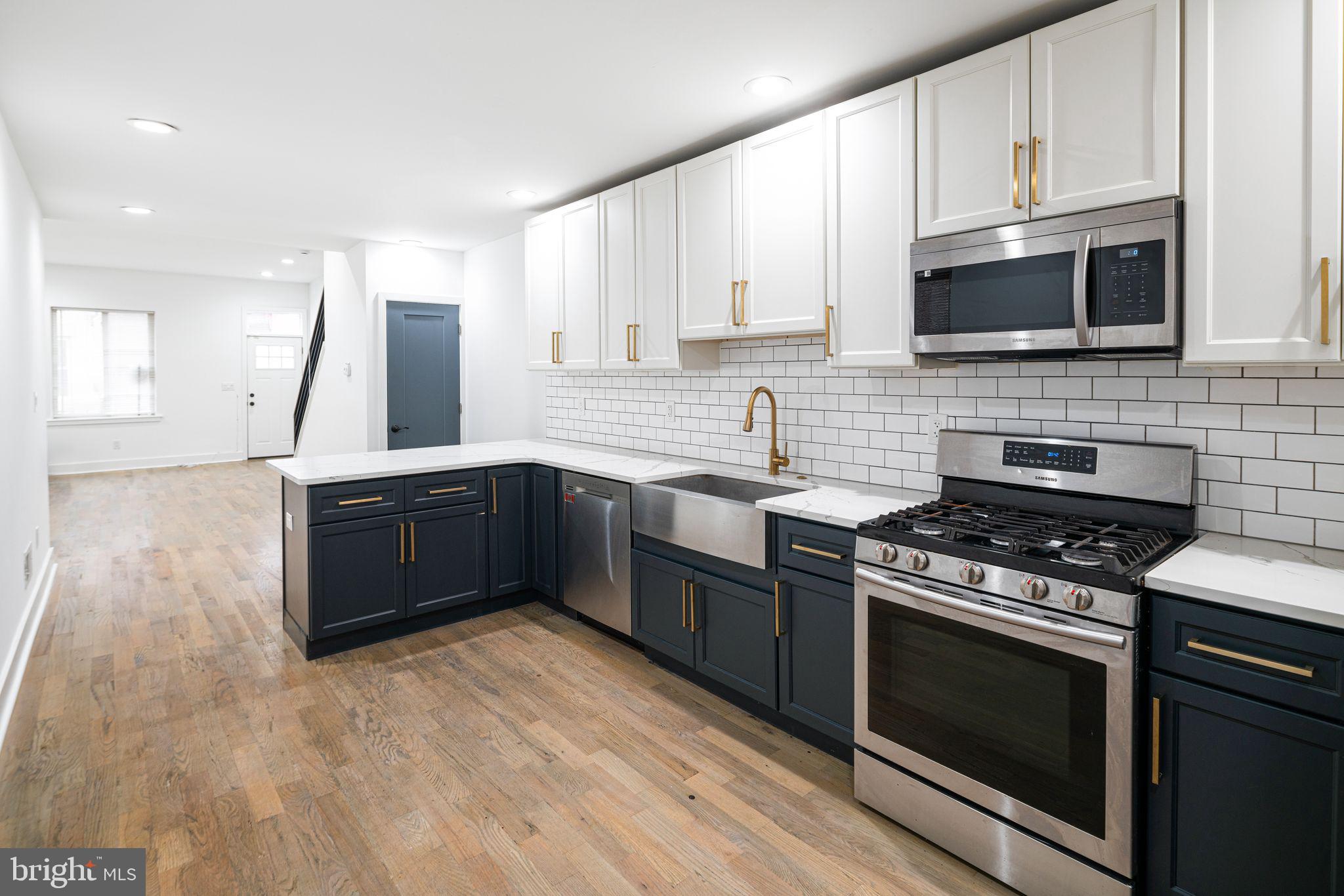 Welcome to 2532 W Montgomery Ave, a beautifully renovated 2-bedroom, 2-bath home nestled in the desirable Sharswood section of Philadelphia. This move-in-ready residence features a bright, straight-through layout that seamlessly connects the living room to a modern kitchen outfitted with sleek stainless-steel appliances, elegant marble countertops, and ample cabinetry—perfect for both everyday living and entertaining. Just beyond the kitchen, step into a private, fenced-in backyard ideal for relaxing or hosting gatherings. Upstairs, you’ll find two generously sized bedrooms and two stylish full bathrooms, including one with a double vanity for added comfort and convenience. Recessed lighting throughout the home enhances its clean, contemporary feel, while a full, dry basement provides plenty of storage space. Located just minutes from Fairmount Park, Temple University, and an array of local dining and shopping options, this home offers both comfort and convenience in a vibrant neighborhood. Don’t miss your chance to own this stunning property—schedule your showing today and experience everything this home has to offer.