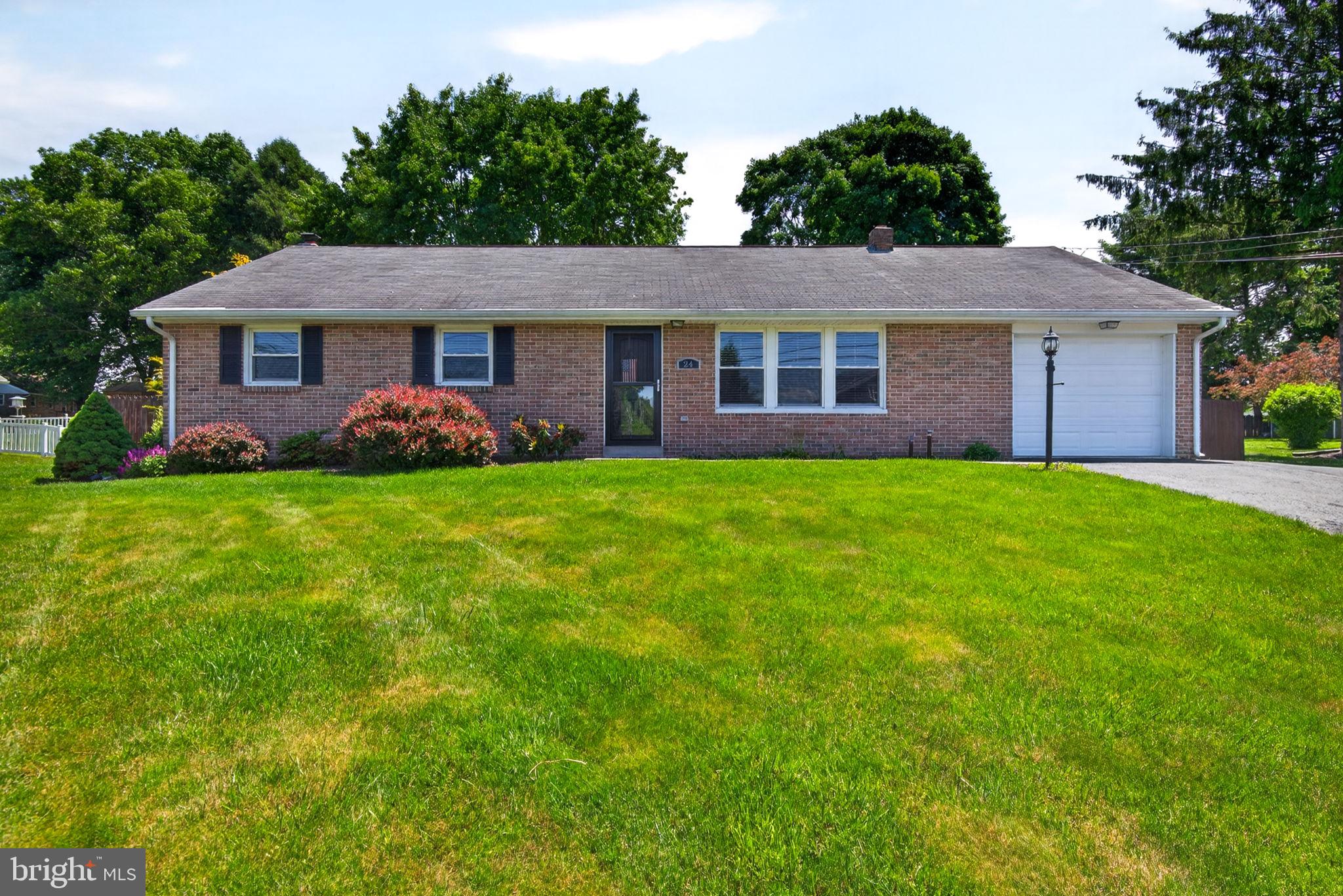 This well-maintained brick ranch, built by Lloyd May Builders, located in Lititz, offers timeless quality and comfortable one-floor living. Featuring 3 bedrooms and 1 recently updated bath with a walk-in shower, this home combines classic charm with thoughtful updates throughout. Hardwood flooring flows through the home, while the spacious kitchen is designed for both function and style with an island and pantry, which feature pull-out drawers, and plenty of workspace.  Enjoy relaxing or entertaining in the fenced-in private backyard complete with a patio and awning for added shade and comfort. Additional highlights include a 1-car garage, full basement offering abundant storage or future potential, and a newer oil tank for peace of mind. A wonderful opportunity to own a solidly built home in a desirable setting!