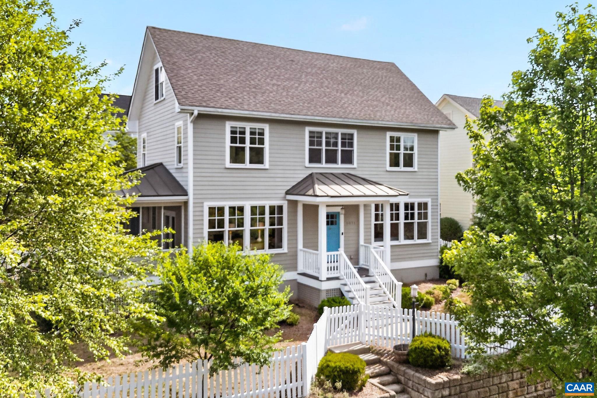 Set across from the community park in Old Trail, this light-filled home pairs a classic neighborhood setting with beautiful Blue Ridge views and thoughtful recent improvements. The main level offers an easy, open flow with hardwood floors, a generous kitchen island, dining area, living room, mud/laundry room, full bath, and a flexible office or guest space.  Upstairs, the spacious primary suite captures mountain views and includes a large walk-in closet and private bath, while two additional bedrooms share a hall bath. The walk-up attic can be easily finished for a playroom, guest room, studio, office, or bonus space. Outside, enjoy a freshly painted screened porch, freshly painted fence, flat yard, and a new 16-foot stamped concrete patio.�Recent updates include a rebuilt front porch with composite decking, newly tiled mud/laundry room flooring, a refreshed downstairs full bath, new electric range, Wemo smart switches in the living room, dining room and island area, and two Nest thermostats that convey. Come see this move-in ready home in a picturesque, quiet setting steps from downtown Crozet and Old Trail's abundant amenities.,Cherry Cabinets,Formica Counter