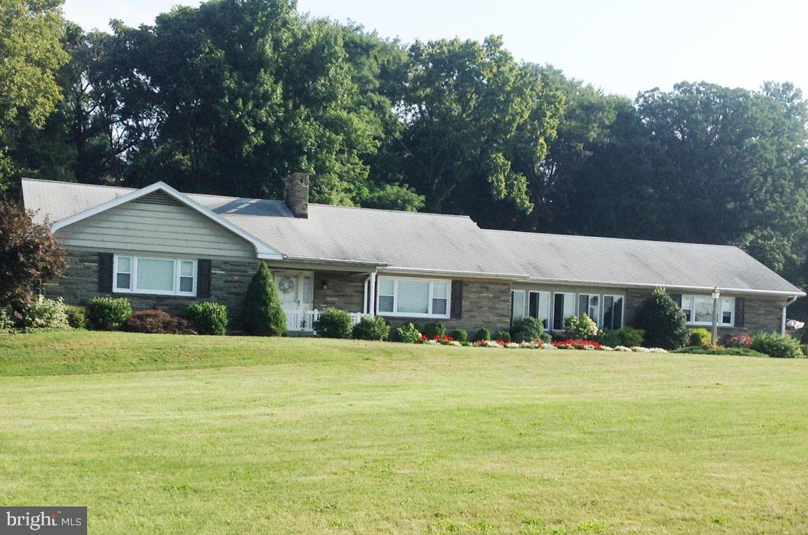 Beautiful ranch style home on large lot with farmland views. Many upgrades. Conveniently located. Open floor plan, large sunroom, 2 car Attached plus 1.5 car Detached Garage, gazebo, spacious bedrooms, large finished basement with second kitchen, bar area, full bath. Great for in law quarters/fourth bedroom.