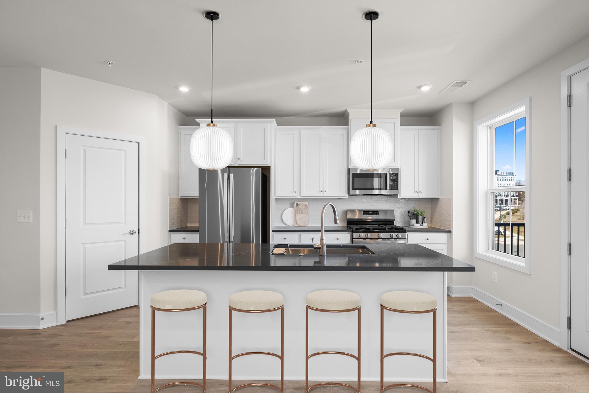 Don’t miss this opportunity to own your dream home! This brand-new incredible TOWNHOME-STYLE CONDOMINIUM by Van Metre Homes at DEMOTT & SILVER is available for you to call home JANUARY 2025! Spanning 2,291 finished square feet across 4 levels, the CAMERON 24-R1 floorplan offers an unparalleled blend of sophistication and convenience. As you step inside, natural light floods the main level, illuminating the expansive great room and the elegant rear-set kitchen, complete with upgraded cabinets, tile backsplash, quartz countertops, and stainless-steel appliances. Upstairs, the lavish primary suite awaits, boasting a large walk-in closet and a spa-like 5-piece bathroom complete with double sinks, an attractive soaking tub, and an oversized, frameless shower enclosure with a built-in seat, a place to rejuvenate and prepare for the day's adventures or to unwind as evening falls. The top-level features two additional bedrooms and a full bathroom, while the lower level welcomes you with a gracious foyer and mudroom, providing seamless access to your one-car private garage. This meticulously designed home combines the spaciousness of a townhome with the low-maintenance ease of condominium living. And being a new build, your home is constructed to the highest energy efficiency standards, comes with a post-settlement warranty, and has never been lived in before! This home is truly a must-see, promising comfort, style, and quality. Schedule your appointment today and make your dream home a reality! ----- Discover Demott & Silver, Van Metre’s exceptional community of townhomes and townhome-style condominiums nestled within the master-planned Broadlands community. This sought-after neighborhood offers unparalleled convenience with walking distance access to Metro’s Silver Line and the area’s most desirable amenities. Residents relish in a host of top-notch amenities across Broadlands, including a clubhouse, fitness center, three pools, tennis courts, vast green spaces, and extensive hiking and biking trails. With shopping, restaurants, Metro’s Ashburn Station, a bus stop, and nearby commuter routes at your fingertips, Demott & Silver is set to become the epitome of a superior community in Broadlands. ----- Take advantage of closing cost assistance by choosing Intercoastal Mortgage and Walker Title. ----- Other homes sites and delivery dates may be available. ----- Pricing, incentives, and homesite availability are subject to change. Photos are used for illustrative purposes only. For details, please consult the Community Experience Team.