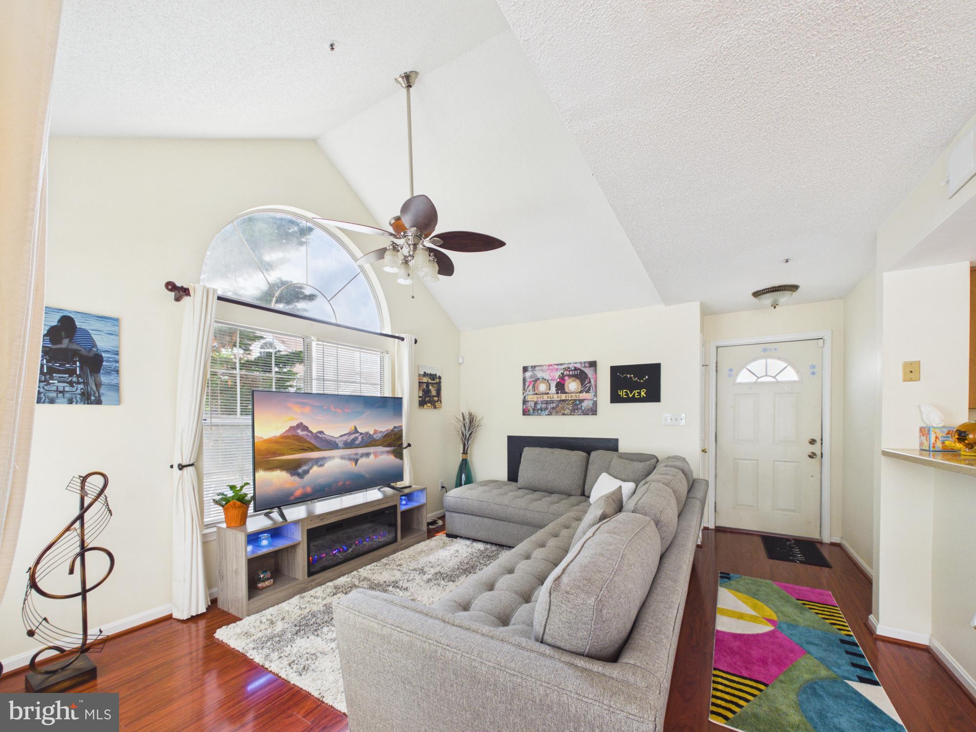 Welcome home to this beautifully maintained 2-bedroom, 2-bath condo in the highly desirable Vistas at Bowie Town Center! Offering the perfect blend of comfort, convenience, and style, this inviting residence features an open-concept living area with soaring vaulted ceilings and oversized windows that flood the space with natural light. Enjoy entertaining in the formal dining area and preparing meals in the spacious kitchen with ample cabinetry and storage. Hardwood flooring adds warmth and elegance throughout the main living spaces, while the in-unit washer and dryer provide everyday convenience. Retreat to the generously sized bedrooms, including a spacious primary suite designed for comfort and relaxation. Residents enjoy access to community amenities including scenic walking and jogging paths, picnic areas, and tot lots. With open parking and an unbeatable location just minutes from Bowie Town Center, you'll enjoy easy access to shopping, dining, entertainment, and everyday conveniences. Whether you're a first-time buyer, downsizing, or seeking low-maintenance living, this move-in-ready gem is one you won't want to miss. Schedule your private tour today!