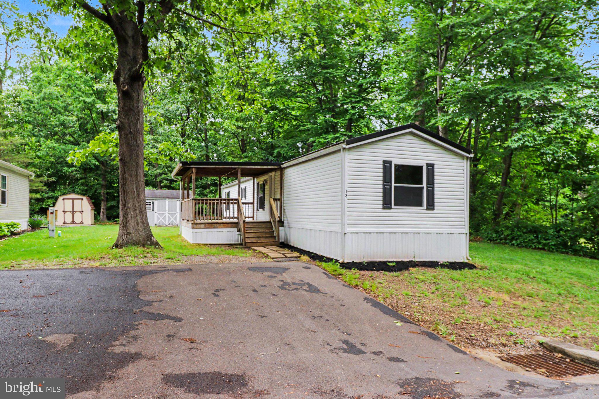 Welcome to 73 S. Elmer in Peaceful Halifax Village — a well-maintained 2000 Fleetwood single-wide mobile home offering comfort and affordability in a peaceful setting. This home features 3 bedrooms, 1 full bath, and 924 sq. ft. of living space, making it a great fit for first-time buyers, downsizers, or anyone seeking one-level living. Inside, you’ll find brand-new flooring throughout and all-new windows, adding both style and efficiency. Outside, enjoy the covered front porch — perfect for morning coffee or relaxing evenings — plus a yard with mature trees and a storage shed for all your outdoor needs. Located in a quiet community, lot rent is just $450/month, which includes water and sewer. Easy access to nearby shopping, dining, and schools makes this a convenient choice in a country-like setting.

Inside, you’ll find brand-new flooring throughout and all-new windows, adding both style and efficiency. Outside, enjoy the covered front porch — perfect for morning coffee or relaxing evenings — plus a yard with mature trees and a storage shed for all your outdoor needs.

Located in a quiet community, lot rent is just $425/month. Easy access to nearby shopping, dining, and schools makes this a convenient choice in a country-like setting.
