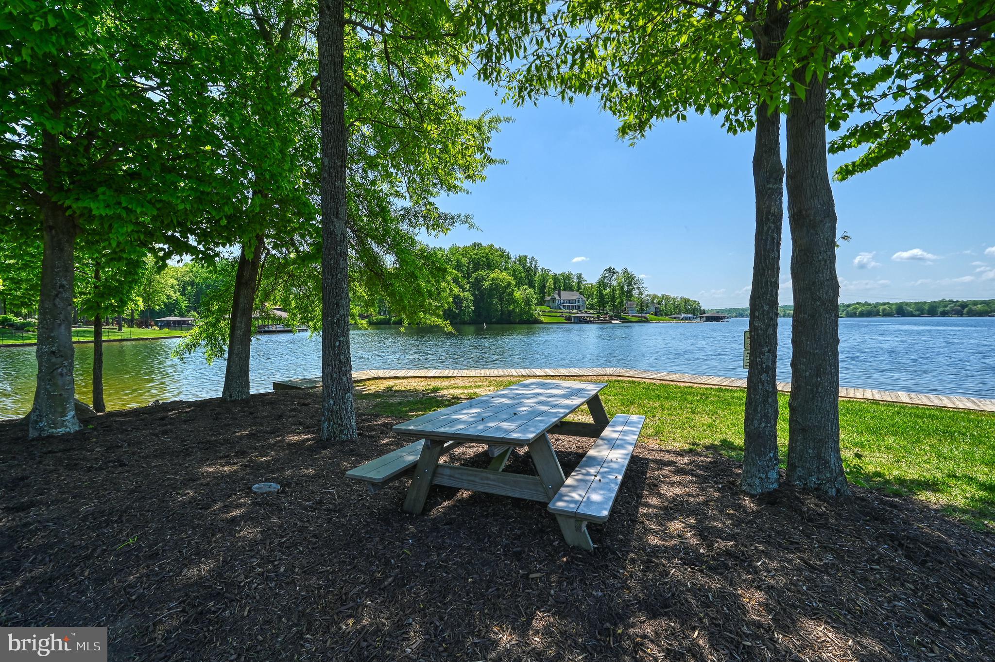 Covered boat slip with lift included. Located in the prestigious Mill Run community on the private side of Lake Anna, this lot offers the opportunity to build your ideal lake home and enjoy everything lake living has to offer. Spend your days on the water with easy access from your assigned slip, and relax in the beautiful common area designed for enjoying time by the lake. Mill Run is known for its well-maintained properties, peaceful setting, and sought-after location, making it ideal for both full-time living or a weekend retreat.