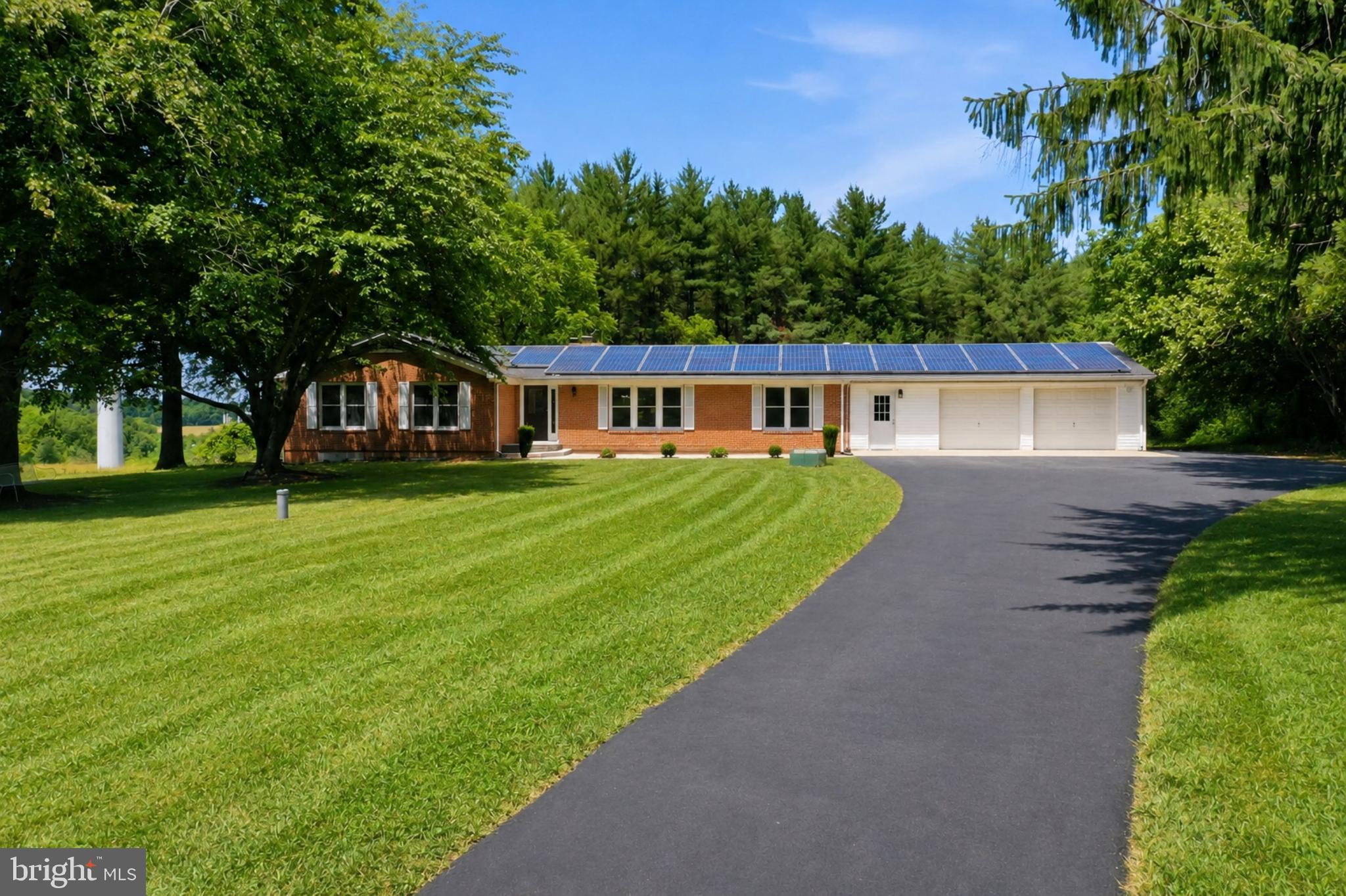 Welcome to this beautifully renovated rambler situated on 2.65 acres offering the perfect blend of space, comfort and versatility. With approximately 4,344 square feet of living space, 6 bedrooms and 4.5 bathrooms, this impressive home makes it ideal for multi-generational living, large households, or those seeking additional income potential.



At the center of the backyard is a stunning 33’ x 15’ in-ground swimming pool. With a generous pool deck, spacious patio and fully fenced grounds, you can enjoy your own retreat with 2.65 acres of privacy surrounding you. 



Inside, the home is equally impressive. Sunlight fills the open-concept main level, highlighting rich hardwood floors, luxury vinyl plank finishes and elegant recessed lighting throughout. The chef’s kitchen is beautifully designed with premium KitchenAid appliances, quartz countertops, abundant cabinetry and a large center island that naturally becomes the heart of daily life and entertaining.



What truly sets this home apart is its extraordinary flexibility. The expansive walkout lower level offers a full second kitchen and private living spaces create an ideal opportunity for multi-generational living, an in-law suite, long-term guests or private accommodations. Beyond that, an entirely separate entertainment space with a fireplace provides exceptional space for a billiards room, media center, lounge seating, gaming area and custom bar setup—offering endless possibilities for entertaining.



Energy-efficient solar panels provide long-term value, while the attached two-car garage offers additional storage and workspace.
More than simply a home, this is a destination designed to bring people together and support every stage of life.