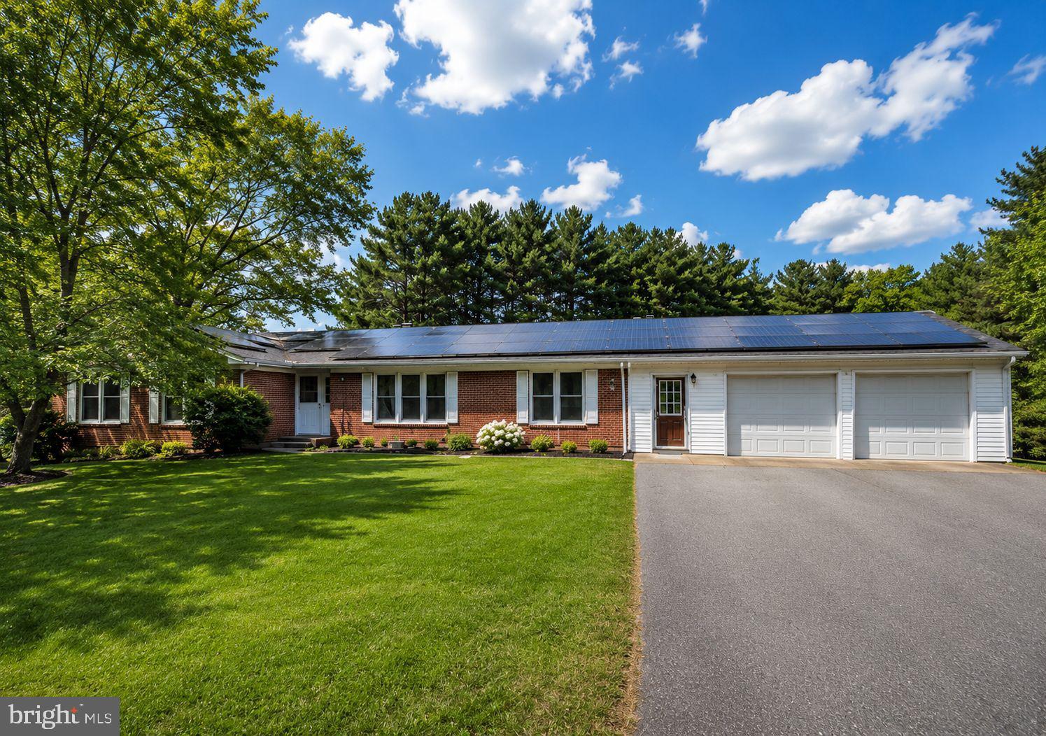 Welcome to this beautifully renovated rambler situated on 2.65 acres offering the perfect blend of space, comfort and versatility. With approximately 4,344 square feet of living space, 6 bedrooms and 4.5 bathrooms, this impressive home makes it ideal for multi-generational living, large households, or those seeking additional income potential.



At the center of the backyard is a stunning 33’ x 15’ in-ground swimming pool. With a generous pool deck, spacious patio and fully fenced grounds, you can enjoy your own retreat with 2.65 acres of privacy surrounding you. 



Inside, the home is equally impressive. Sunlight fills the open-concept main level, highlighting rich hardwood floors, luxury vinyl plank finishes and elegant recessed lighting throughout. The chef’s kitchen is beautifully designed with premium KitchenAid appliances, quartz countertops, abundant cabinetry and a large center island that naturally becomes the heart of daily life and entertaining.



What truly sets this home apart is its extraordinary flexibility. The expansive walkout lower level offers a full second kitchen and private living spaces create an ideal opportunity for multi-generational living, an in-law suite, long-term guests or private accommodations. Beyond that, an entirely separate entertainment space with a fireplace provides exceptional space for a billiards room, media center, lounge seating, gaming area and custom bar setup—offering endless possibilities for entertaining.



Energy-efficient solar panels provide long-term value, while the attached two-car garage offers additional storage and workspace.
More than simply a home, this is a destination designed to bring people together and support every stage of life.