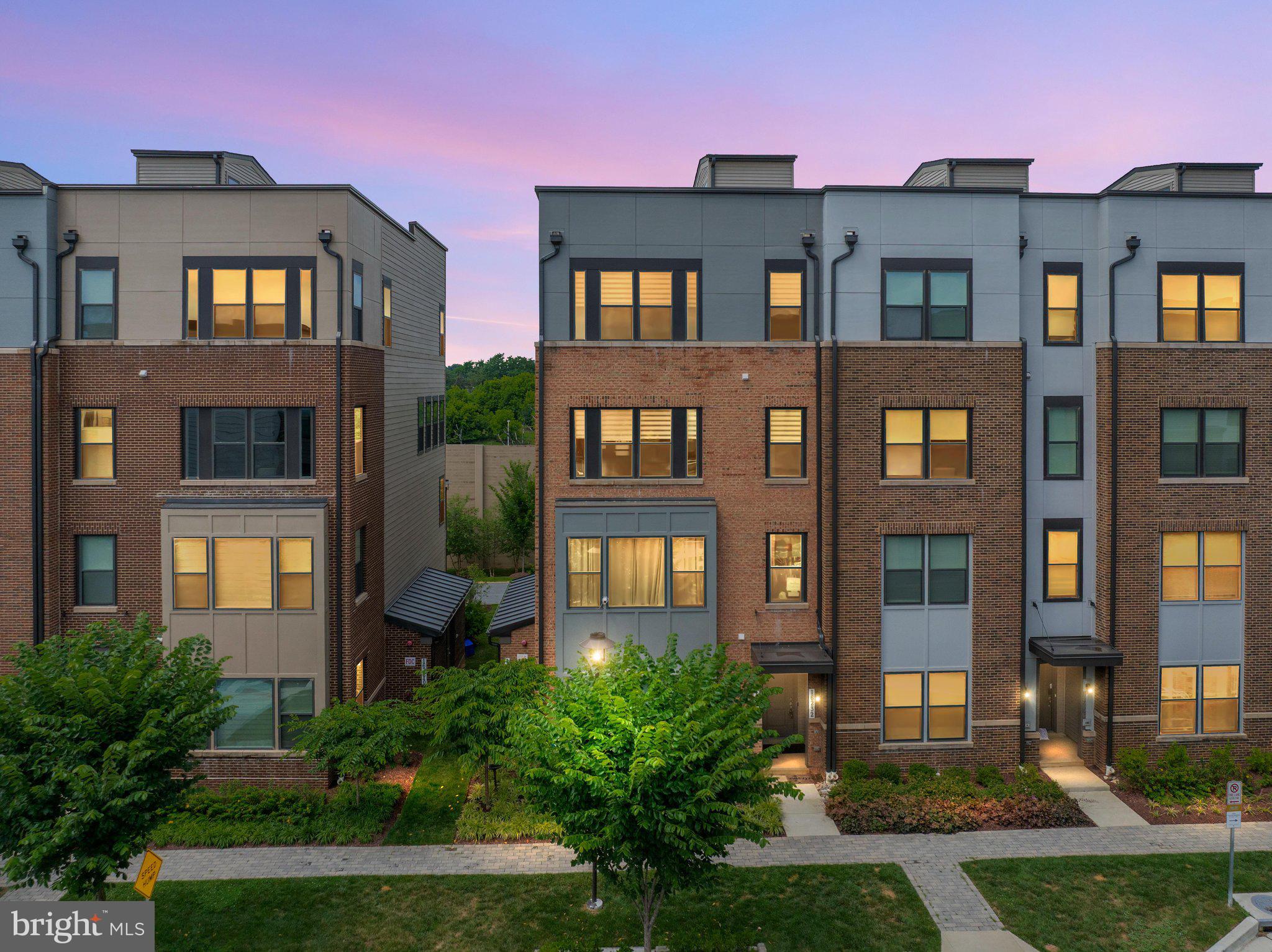 Turnkey luxury, zero compromises: this rare 3 bedroom, 2.5 bathroom end-unit townhome was built in 2022 and owned by just one family — a luxury contractor who upgraded everything a discerning buyer dreams of, then kept it in pristine condition. Every builder upgrade came standard; premium owner enhancements took it even further.

The corner/end-unit location brings extra light and privacy, while the private rooftop terrace offers the perfect spot to unwind or entertain under the sky. Inside, coffered ceilings crown the living room, and engineered hardwood floors flow across both levels. Every door has been upgraded to solid core with designer hardware, and the entire home was freshly painted with premium Benjamin Moore Aura paint.

The gourmet kitchen features double ovens and newly serviced appliances, ready for everything from weeknight dinners to holiday hosting. The fully renovated primary bathroom delivers a spa-like retreat, heated floor and complemented by a custom walk-in closet — with custom closets in both secondary bedrooms as well. A beautiful custom walnut built-in anchors the family room, and the home is fully wired for a top-of-the-line sound system in both the living area and primary bedroom. The epoxy-finished garage adds durable style plus smart storage.

Ideally situated near Shady Grove Metro, with easy access to shopping and dining at Rio and Crown, plus nearby parks and everyday conveniences — this is Rockville luxury living at its finest. Schedule your private tour today!