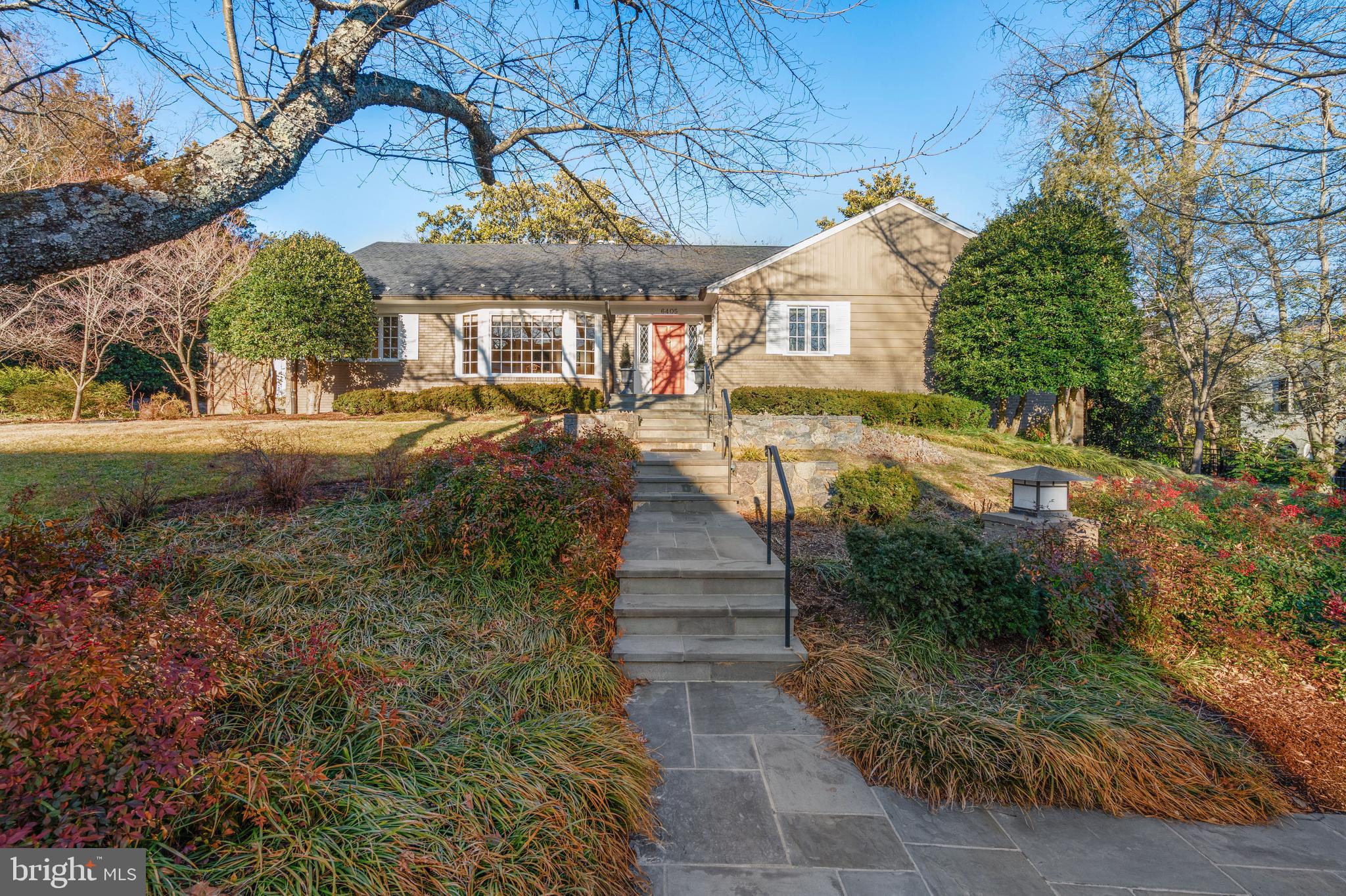 Imagine the wonder and convenience of one-level living in the premier neighborhood in Chevy Chase, Kenwood!  With five bedrooms, four full bathrooms and one half bathroom, this house offers abundant space on the main level for comfortable living and entertaining, and the upper and lower levels offer copious space for visiting family and friends, all on a beautiful, .364-acre lot with mature plantings.  The current owners undertook a substantial renovation several years ago with premier builders BOWA and Smith, Thomas & Smith that included, among many upgrades, adding a shed dormer to the rear of the upper level to enable two bedrooms and two bathrooms along with an inviting living room, replacing the kitchen, adding the breakfast area, converting a step-down screened porch into a level sunroom, creating the main level primary suite, finishing the main level office, upgrading the lower level to accommodate the current in-law suite with ample living area and building the two rear terraces.  This property is bathed in natural light and is in coveted, move-in condition.

The developers of Kenwood in the 1920s "hoped to make Kenwood attractive to the successful, hard-working men and women who shared their conviction that one's community is more than just a place to live (A History of Kenwood).  This sense of community, along with the nearly two thousand cherry trees planted between 1929-1934, make this a very special place to live.  Garnett Drive sits quietly on the western edge of this quiet neighborhood, backing to Kenwood Country Club, and the street traffic is very light.  The ultra-convenient location is minutes from the finest private and public schools in the area, restaurants, shopping, the Friendship Heights and Bethesda Metro stations and The Crescent Trail.
