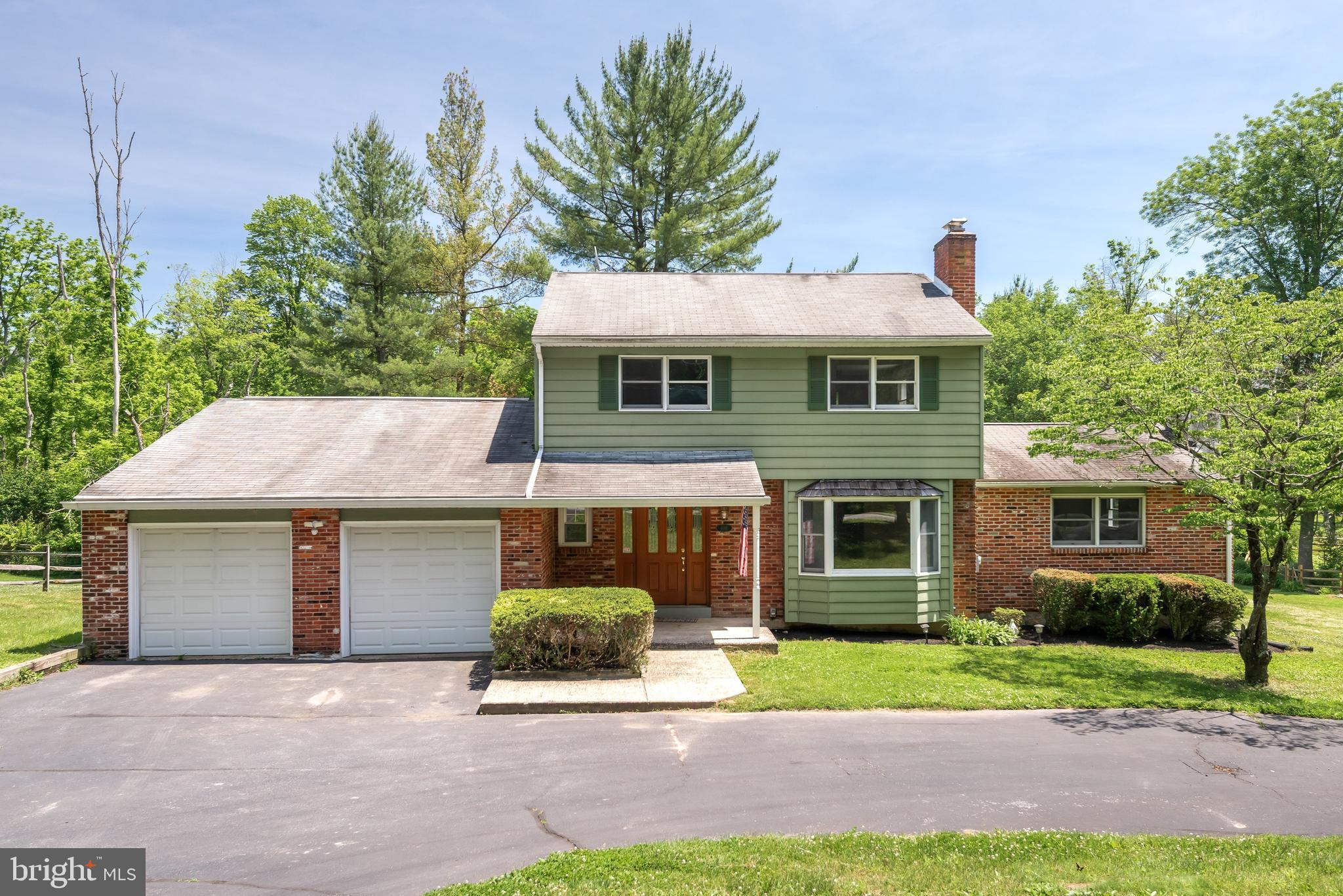 Welcome to 108 Sheeder Road, a charming 3-bedroom, 2.5-bath home nestled on a picturesque 2.1-acre property complete with a tranquil pond, refinished springhouse, and scenic outdoor spaces. Step inside to find a sun-filled living room featuring a classic brick fireplace, creating a warm and inviting atmosphere. The formal dining room offers sliding glass doors that open to an expansive deck, seamlessly blending indoor and outdoor entertaining while providing peaceful views of the water and surrounding landscape. The spacious kitchen is equipped with abundant cabinetry and generous workspace, and table space making meal preparation and storage effortless. The heart of the home is the stunning family room, where exposed wood beams and a second brick fireplace add character and charm. Just beyond, a versatile recreation room showcases a wall of windows overlooking the grounds, along with a built-in bar, access to the back deck, and a full bath—ideal for gatherings, hobbies, or flexible living arrangements. A convenient mudroom/laundry area (hook-up) and powder room complete the main level. Upstairs, the generously sized primary suite is accompanied by two additional bedrooms and a well-appointed hall bath. Outside, the property's natural beauty truly shines. The refinished springhouse, complete with its own fireplace, offers endless possibilities as a studio, retreat, or home office. The pond with koi fish creates a serene backdrop, while the expansive level yard provides plenty of room for recreation, gardening, or simply enjoying the peaceful surroundings (switch for fountain in middle of pond can be found in rec room). Offering the perfect balance of privacy and convenience, this exceptional property is just minutes from major commuting routes, shopping, dining, and all that the Phoenixville area has to offer.  Schedule your showing today!