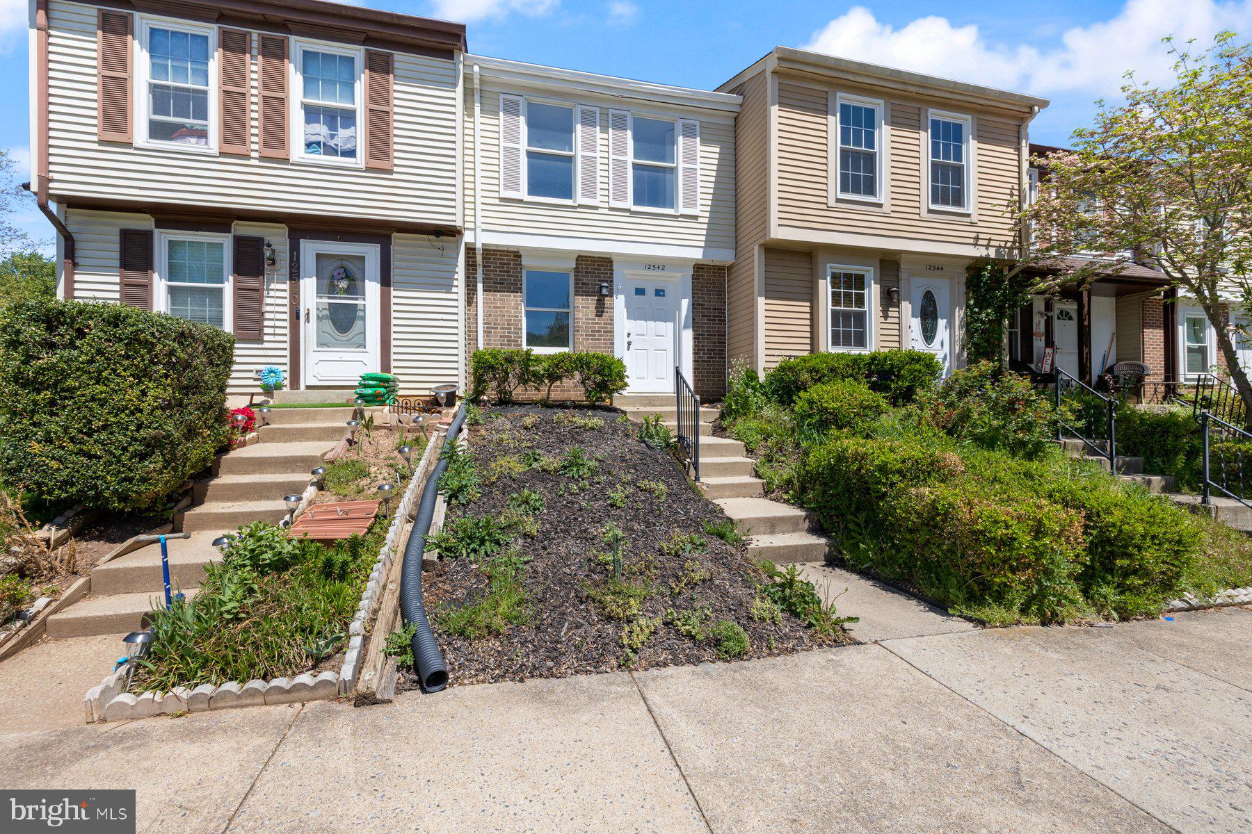 This beautifully maintained townhome features a freshly updated kitchen, brand-new carpeting, and fresh paint throughout. Enjoy indoor-outdoor living with direct access from the spacious living room to a private, fenced backyard complete with a wood deck—perfect for relaxing or entertaining. Ample unassigned parking ensures convenience for residents and guests alike. Ideally located near shopping, dining, and recreational options, with easy access to public transportation and major commuter routes.