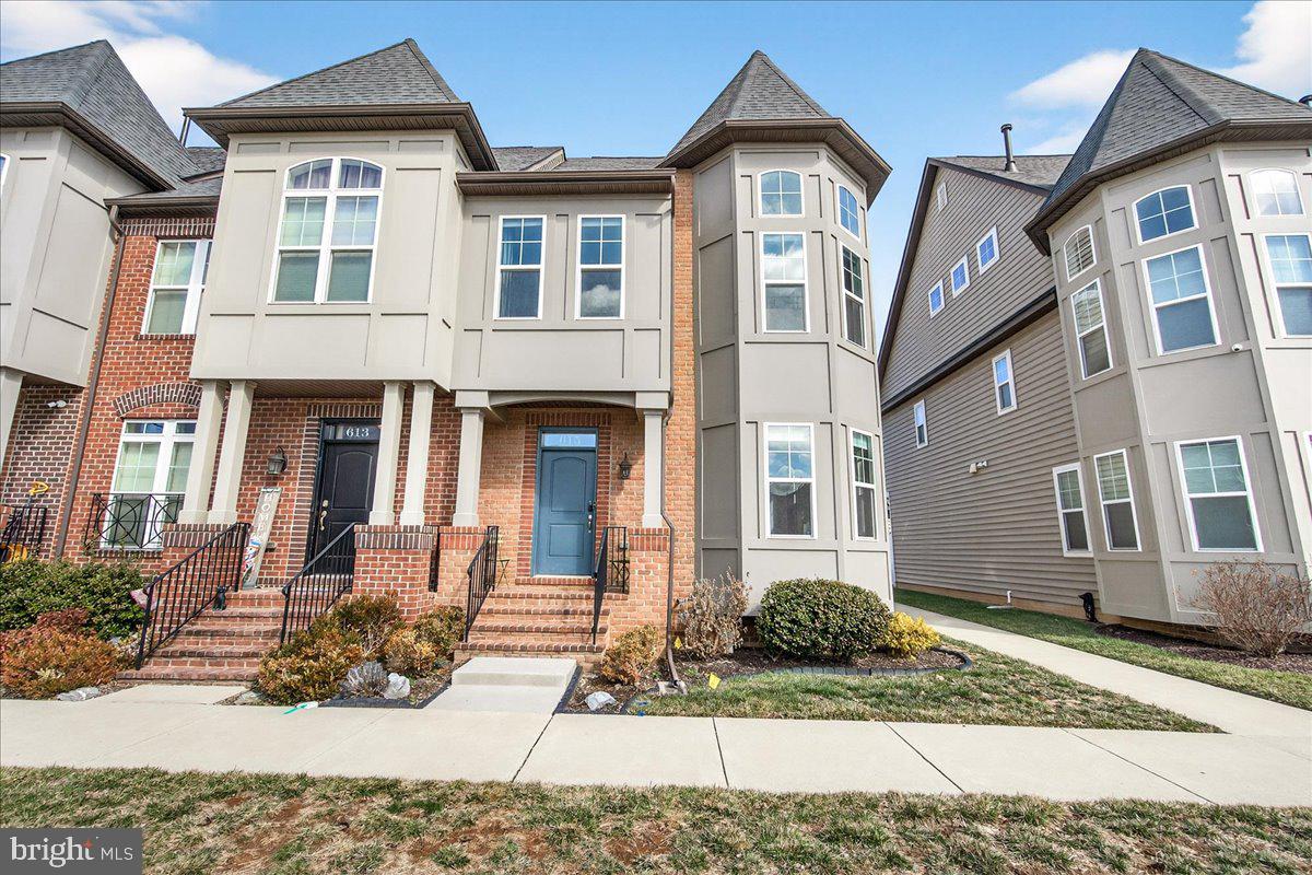 WOW! Welcome to this stunning 3 bedroom 3.5 bath updated Grand Ashcroft model 4-level end-unit townhome with full home 3 foot bump out in the Eastchurch community.  This property has been meticulously maintained with a main level dominated by a gourmet kitchen that has a large 14 foot long granite double water fall island with over hang bar seating, high-end Kitchenaide stainless steel appliances, a 6 burner stove with over head hood vent, a built-in microwave, double ovens and a massive pantry, with subway tile back splash. The home has an open floor plan with reclaimed white oak hard wood floors throughout, a cozy cement stone surface gas fireplace in the rear main level living room, upper top level loft with additional living space and a wet bar, skylights, and rooftop balcony. The upper 2nd level features the primary owners suite with a spacious walk-in closets, a massive full bathroom with a dual vanity and walk-in glass subway tiled shower, a separate toilet, and additional "make-up" area.  Two additional generously sized bedrooms on this 2nd level share a dual sink full bath, along with a conveniently located laundry area with a front loading washer and dryer. The home has a sprinkler system throughout, recessed lights on all levels with 9ft+ ceilings, detached 2-car garage connected to the home by a fenced stone rear patio, that opens to mud/coat area. The lower level is a fully finished and carpeted basement with full bath and possible 4th bedroom or in home office. 2TVs  on main and top level and 3 ceiling fans convey with the home.  Enjoy all that Eastchurch has to offer, including a historic community building, pavilion with tables, chairs, and outdoor fireplace, tot lots, an in-ground pool, and more. Ideally located close to all things Frederick and major commuter routes.