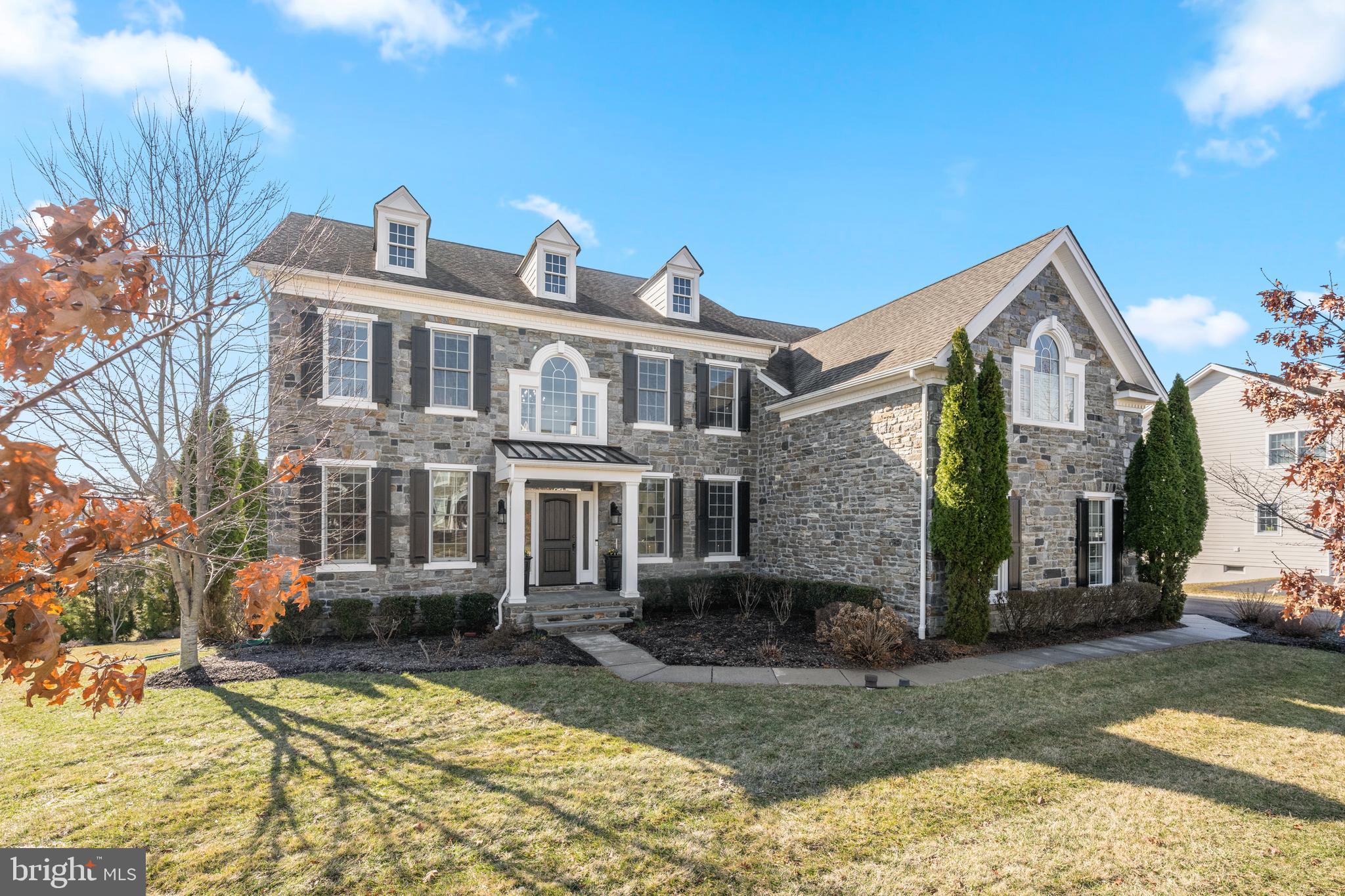OPEN HOUSE SUNDAY, APRIL 19, 12-2 PM....Welcome to this beautifully expanded Duke model in the sought after Liseter community, where thoughtful upgrades and refined design come together seamlessly. Featuring an expanded family room, sunlit breakfast room with skylight, enhanced kitchen, THREE CAR GARAGE with EV charger, and a fully finished walkout lower level with recreation space and movie theater, this home delivers both everyday comfort and elevated living. This lovely home is equipped with several smart features, like automated window shades, remote locks and new smart garage motors/remotes, smart Phillips Hue lighting throughout and a nest thermostat. An airy two-story foyer with a sweeping curved staircase and upgraded spindles sets the tone, complemented by rich hardwood flooring throughout. The center hall is elegantly framed by formal living and dining rooms, (currently used as a billiards room) complete with chair rail and crown molding—ideal for both entertaining and quiet gatherings. At the heart of the home, a dramatic two-story family room showcases a floor-to-ceiling stone gas fireplace and surround sound for optimal TV viewing, and flows effortlessly into the open-concept kitchen and breakfast area. The Palladian kitchen features a large center island, granite countertops, double ovens, 5 burner cooktop, walk-in pantry and wine fridge. All of the appliances are new smart stainless steel appliances—perfectly suited for both hosting and daily life. Step outside to the expansive deck, ideal for al fresco dining, complete with a dedicated gas line for grilling. A private study, powder room, mudroom with laundry, and access to the three-car garage complete the main level. Upstairs, there is a large landing overlooking the family room. This home offers four spacious bedrooms and three full baths. The luxurious primary suite is a true retreat, featuring a sitting room, three walk-in closets, a dedicated makeup vanity, and a spa-inspired bath with dual vanities, heated floors, an oversized shower with two shower heads, and a 5' jetted Jacuzzi tub. Two additional bedrooms share a well-appointed hall bath with tub/shower combo, while a princess suite includes its own private bath with stall shower. The walkout lower level is an entertainer’s dream—offering a large recreation area, full bath, and a fully equipped home theater with reclining seating, projector, and surround sound for a true cinematic experience. New hot water heater in 2026. In Liseter community, residents enjoy resort-style amenities including an infinity pool, tennis and pickle ball courts, basketball court, clubhouse with fitness center and yoga studio, party barn, and scenic walking trails. Ideally situated adjacent to Episcopal Academy and within the acclaimed Marple Newtown School District. The new Ellis Preserve with Whole Foods and a myriad of restaurants and shops is a mile away. Freshly painted throughout and ready to move right in! This is more than a home—it’s a lifestyle.