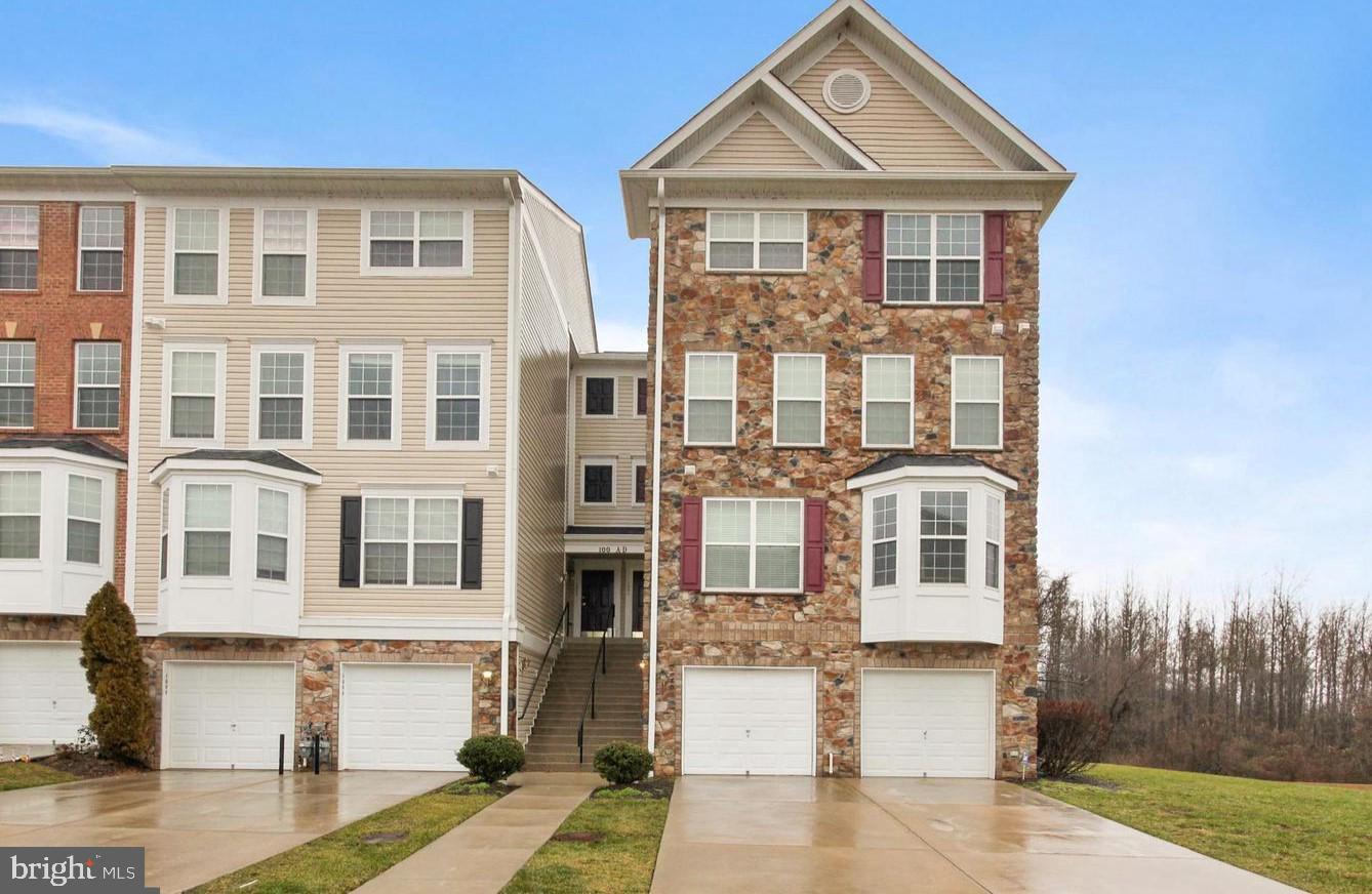 Welcome to 100 Mohegan Drive, #D (not H). This four level condo is located in the sought-after Greenway Farm Community in Havre de Grace. This home has a concrete driveway as well as a one-car garage. Inside the home you'll find  three spacious bedrooms, as well as a bathroom on every level - two full and  two half baths. The primary suite is the entire top floor with a coffered ceiling, recessed lights, luxury bath, walk-in closet and laundry as well. The additional bedrooms have a level of their own - sharing a hall bathroom. The main level has a an eat-in kitchen with stainless steel appliances, granite counters, backsplash, 42-inch cabinets with a breakfast bar. It's open to the living room with gas fireplace. The lower level family room features another fireplace and french doors to back common area for grilling or outdoor entertaining - backing to the woods. Nearby is the award winning Bulle Rock Golf Course, historic downtown Havre de Grace, The Promenade and waterfront as well as Hollywood Casino, the MARC train and more. Recent updates include 2020 - microwave; 2021 - 80-gallon HWH and paint; and 2023 - fridge.