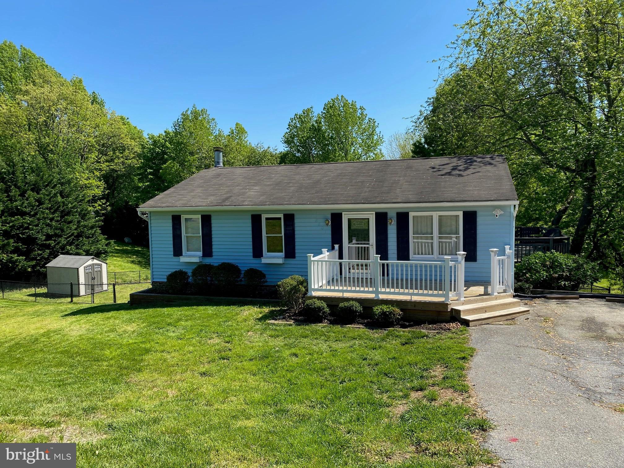 Beautifully renovated home in Chesapeake Beach.  Kitchen renovation inlcude granite, cabinets, wood plank flooring, recessed lights, stainless appliances, & tiled back splash.  Living room is currently used as a  dining room with breakfast bar in between.  Sliders to 3 sided deck that has also been renovated.  Upstairs bath was completely redone to include tiled shower, vanity & tub with air jets.  Basement has wood laminate flooring thru out and features 4th bedroom, 2nd bathroom & family room that has a brick fireplace.  Laundry/ utility room, storage room,  walk out basement.  Hybrid hot water heater, heat pump replaced 2013.  Patio, fenced in back yard.   (Hot tub & Pergola Do not convey.)