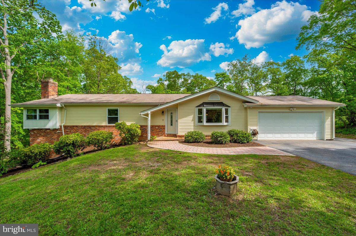 MULTIPLE OFFERS DEADLINE!   All highest and best offers in PRICE and TERMS are due by 6:00 PM on Monday May 12th.

Welcome to 6603 Jacks Court!  This beautifully maintained 4-bedroom, 3-full bath single-family rancher is nestled on over half an acre in a quiet cul-de-sac. Surrounded by mature trees that offer privacy and tranquility, the location also boasts easy access to major routes leading to Baltimore, Washington, D.C., and Frederick. With no HOA and no city taxes, this home is ideal for those seeking both comfort and convenience.

Designed with main-level living in mind, the home offers a warm and inviting layout that works perfectly whether you're looking to grow into a space or downsize to something more manageable. The main level features gleaming hardwood floors throughout, three spacious bedrooms and two full baths, including a large primary suite with an ensuite bath, a brand new tile shower and two oversized closets. Additional bedrooms also provide great flexibility, with space perfect for a home office, den, or craft room.

The heart of the home is the upgraded kitchen, offering granite countertops, stainless steel appliances, custom cabinetry and a center island ideal for extra seating or prep space. The adjoining oversized dining room is perfect for hosting family gatherings, with glass sliding doors that open to a deck overlooking a picturesque backyard oasis. The living room is both open and cozy, featuring a beautiful bay window that fills the space with natural light and offers views of the private wooded lot.

Just outside you’ll find a backyard designed for both relaxation and entertainment. The pool has just been opened for the season, and the hot tub is ready and waiting for those cool, breezy nights under the stars.  A fenced yard and oversized shed add functionality, giving you space for everything from yard tools to recreational gear. The attached two-car garage provides easy access to the kitchen and the backyard.

Downstairs, the partially finished lower level offers even more space to spread out. A large recreation or family room with a wood-burning fireplace creates the perfect spot for movie nights or casual entertaining. There’s also a fourth bedroom and a third full bath that is ideal for guests or multigenerational living as well as door access to the backyard.  An unfinished area provides a blank canvas for a workshop, home gym, or whatever suits your lifestyle.

This Carroll County gem offers peaceful living with unbeatable accessibility. Move-in ready and prepped for summer, it’s time to make this house your home.  Your Oasis Awaits! 
Call today to schedule your private tour!
