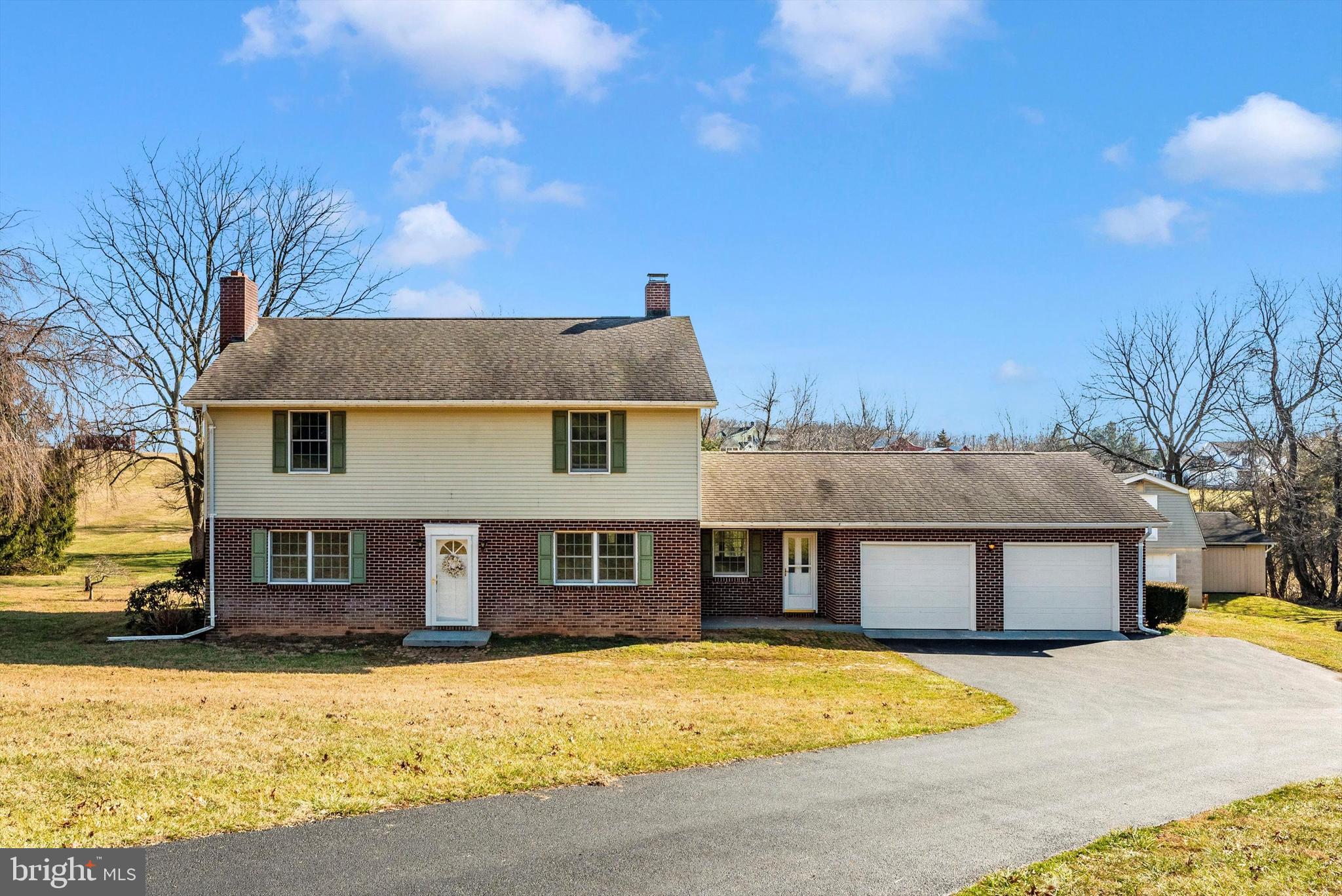 If country living is your priority, this is the home for you! This solid built home is primely located on a 4.27-acre lot in beautiful Carroll County. This unique home boasts generous size rooms and solid hardwood flooring throughout almost every room. The foyer opens to the living room that features hardwood floors, lots of natural light, and a cozy woodstove. On the other side of the foyer is the formal dining room, perfect for hosting guests, with the adjoining butler’s pantry and kitchen. The country kitchen features beautiful tile floor, an abundance of counters and cabinet space, and stainless appliances. The family room adjoins the kitchen and leads to the attached 2-car garage. The main level office is across the other side of the kitchen, making work-from-home that much easier! This office could easily be used as a main level bedroom as well. The main level is complete by a half bath. The upper level provides 4 large bedrooms, all featuring solid hardwood floors, closet space, and lots of windows. The large hall bathroom features dual vanity sinks, walk-in shower, and linen closet. Outside is an entertainer’s dream with the large rear deck, perfect for grilling and hosting summer holidays.   Detached garage wtih storage above and another large storage shed provides extra storage and endless possibilities. This level 4.27-acre lot is perfect for any and all of your outdoor ideas. This home is primely located only 10 minutes from downtown Westminster, breweries and wineries, restaurants, shopping centers, and Carroll Community College!