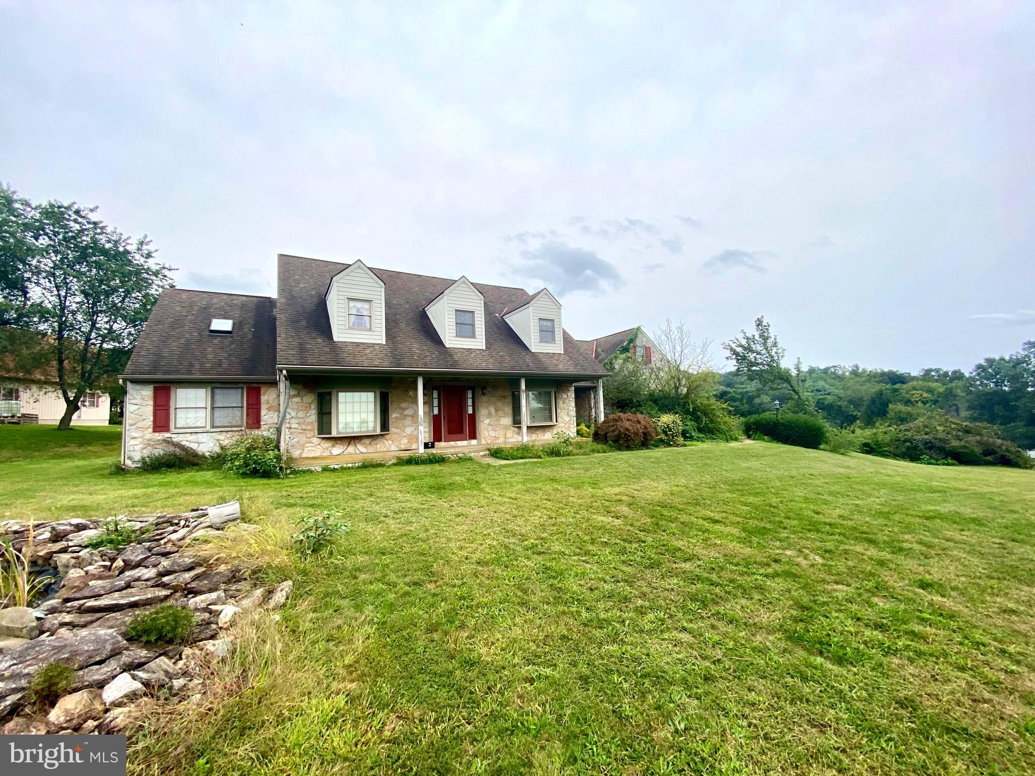 Money making opportunity.  Watch the equity grow while you complete the cosmetic upgrades to bring this home to its prime!  So much potential with over 4 acres of land and breathtaking views.  Prestigious tree lined drive way, and spacious cape cod style home with a main floor suite.  Vaulted ceilings, wood floors, built-ins, open foyer and lots of windows offering plenty of natural light.