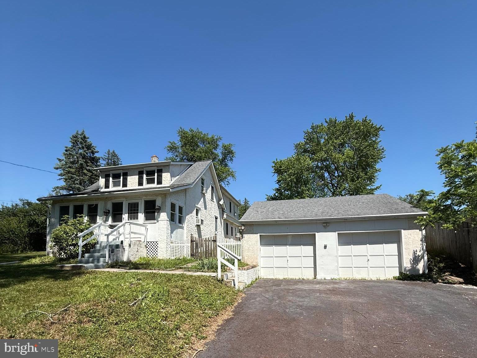 This four-bedroom home offers a functional layout with all bedrooms located on the second floor. A sunroom provides additional living space and features new flooring, which continues into the living room, kitchen, and dining room.

A spacious family room addition features parquet flooring, a flagstone hearth with brick fireplace, a separate exterior entrance, and a rear staircase providing access to the second floor.

The updated hall bathroom includes a built-in Bluetooth speaker. The interior has been recently painted throughout, and new carpeting has been installed in most rooms. Front bedroom features original hardwood flooring.

Additional features include a full waterproofed basement providing ample storage space and an oversized detached two-car garage.

The yard offers outdoor space for a variety of uses and is waiting for your special touches and imagination. This property combines flexible living areas, numerous updates, and practical storage solutions.