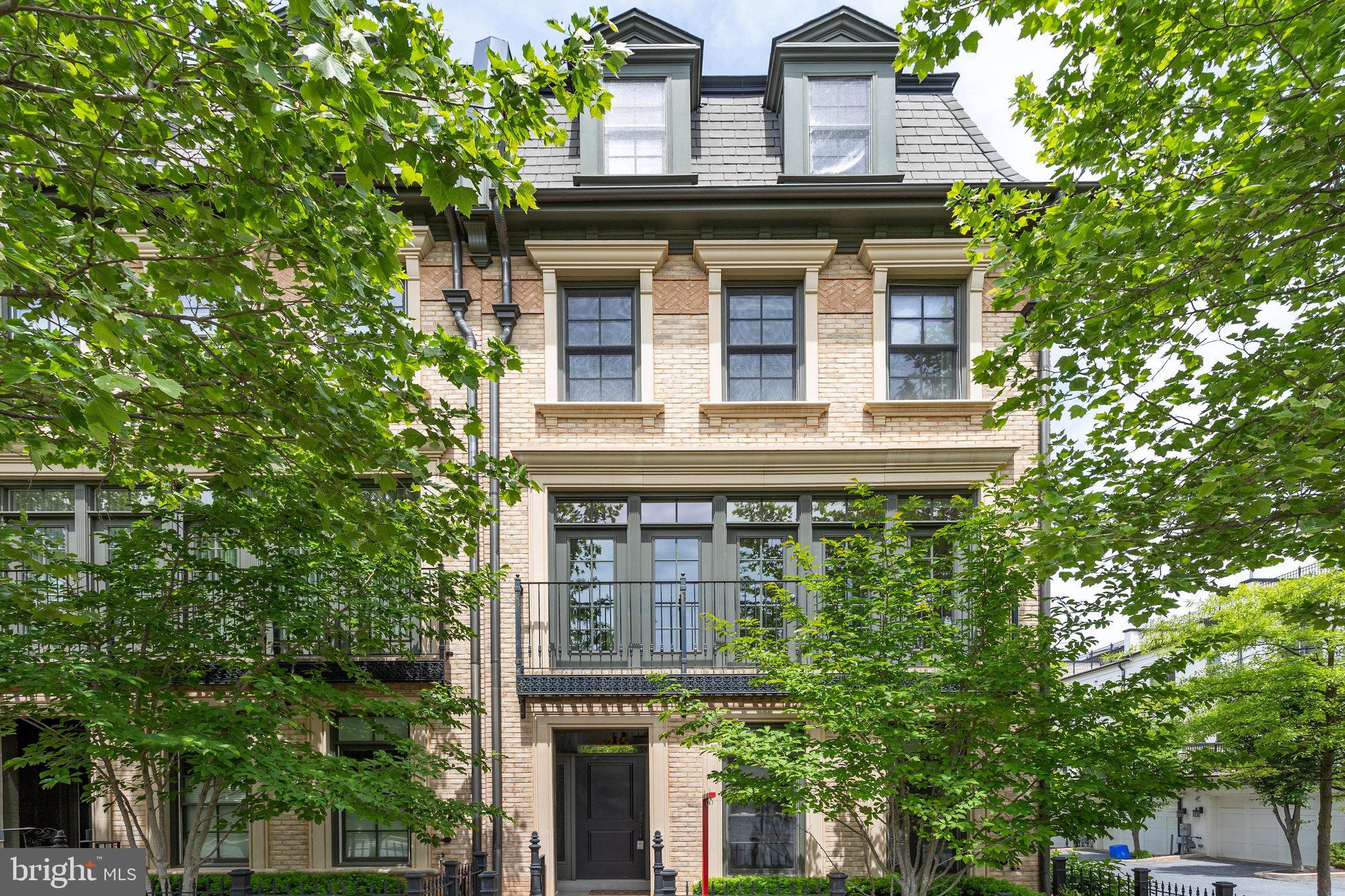 Discover this stunning end unit townhouse in the highly desirable, award-winning neighborhood of Symphony Park, filled with natural light from its many windows.  This home is nestled on a quiet street between two beautifully landscaped parks, and offers 5 spacious bedrooms and 4.5 bathrooms across 4 levels along with elevator access. Enjoy fresh paint throughout and a gourmet kitchen featuring Viking appliances and new quartz countertops. The new carpet adds comfort, while the 2-car garage and additional driveway parking provide convenience. There are guest parking spaces right in front. Step outside to a deck off the kitchen or relax on the rooftop terrace. This property boasts upgrades like 3 bump-outs and custom built-in cabinetry in the dining and living rooms. The main level and owner's suite on the third floor have beautiful hardwood flooring. Plus, you're just a short walk from Grosvenor Metro, Strathmore Music Center, Starbucks/cafes, and Whole Foods.  A quick drive to vibrant shopping and dining options at Pike and Rose and Bethesda Row.