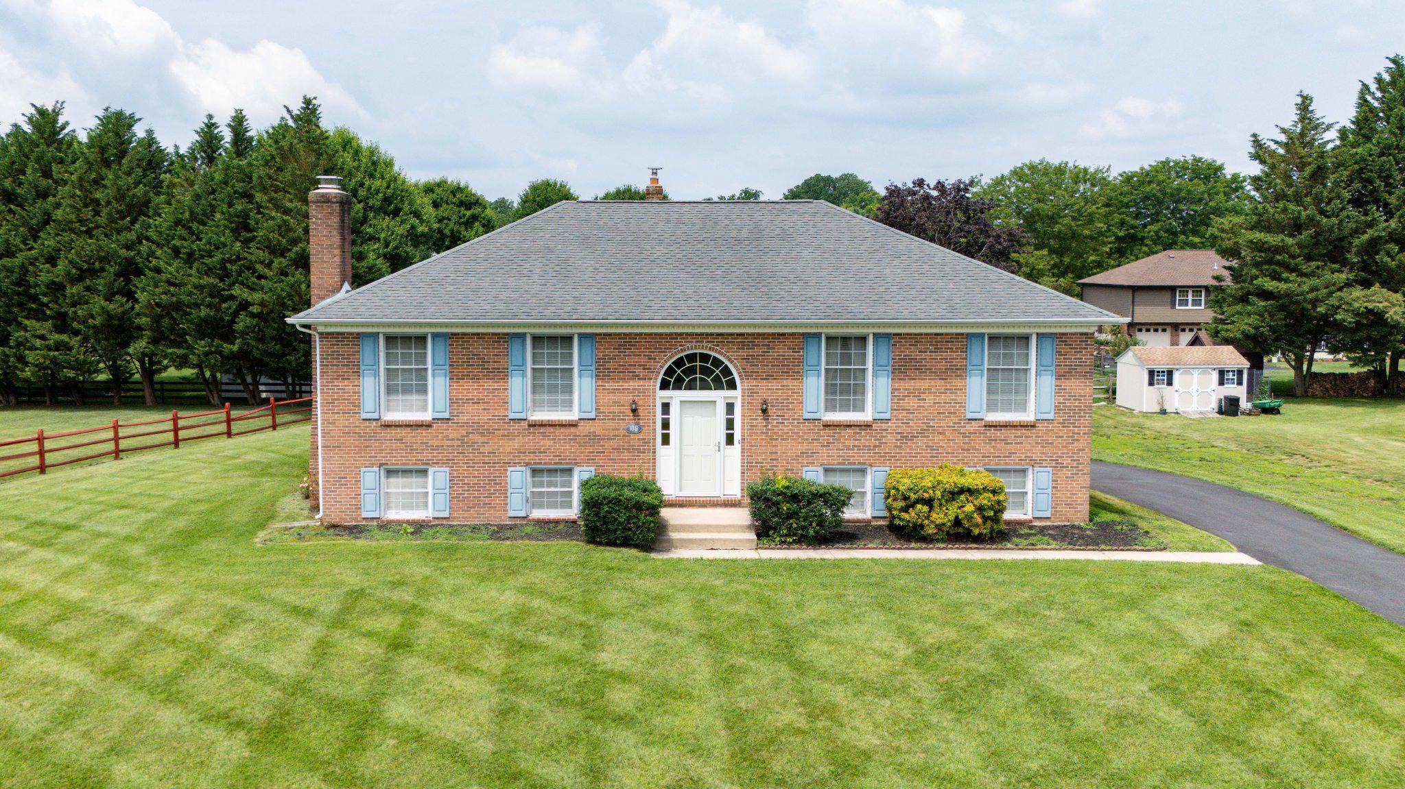 Quality built R.C. Peoples home in the coveted  community of Caravel Woods in Appoquinimink school district and close to Lums Pond State Park for outdoor enthusiasts.  This lovingly cared for home is on a spacious half acre of land, has three bedrooms, two and a half baths, three season room and two car garage. Impressive curb appeal draws your eye with full brick front, hip roof and driveway repaved in 2025. New front door and side lites welcome you into your new home. Large living room with hardwood floor and  crown molding add a touch of elegance.  The hardwood floor, crown molding and chair rail highlight the dining area and kitchen. The kitchen is equipped with an easy clean flat top range, range hood, microwave, dishwasher, refrigerator and double bowl stainless steel sink. Spacious countertops and island with breakfast bar, provides you with plenty of room for kitchen gadgets and work space. There is a tile backsplash for easy clean up. The owner’s suite is sizable with hardwood floors, two closets (one with built ins,) and a full bathroom with tub/shower.  Two more generous size bedrooms with hardwood floor and hall bathroom with tub shower complete the main level. Follow the hardwood stairs and oak rails to the lower level for more living space and amenities. A spacious L shape family room has a brick fireplace with gas insert and wood mantle that is the heart of this room. There is a convenient powder room just by the slider to the three season room. The large three season room is tiled and has panoramic views of the backyard. The laundry room includes the dryer and new washer, has a handy utility sink and room for additional storage.  There is an oversized two car garage with windows for natural light and automatic garage door openers. For additional storage there are pull down stairs to the attic and a shed in the backyard. The heater, A/C and thermostat were replaced in 2020. Your new home has a great location, layout and features but may need some cosmetic updating and is priced accordingly and is being sold as is. Close to local amenities like Lums Pond State Park with the largest fresh water lake in Delaware, hiking and equestrian trails, Glasgow Regional Park with walking paths, playgrounds, skate park and seasonal farmer’s market, People’s Plaza and Fox Run shopping centers.   Don’t miss out on this opportunity to own this cherished home, book your tour today!