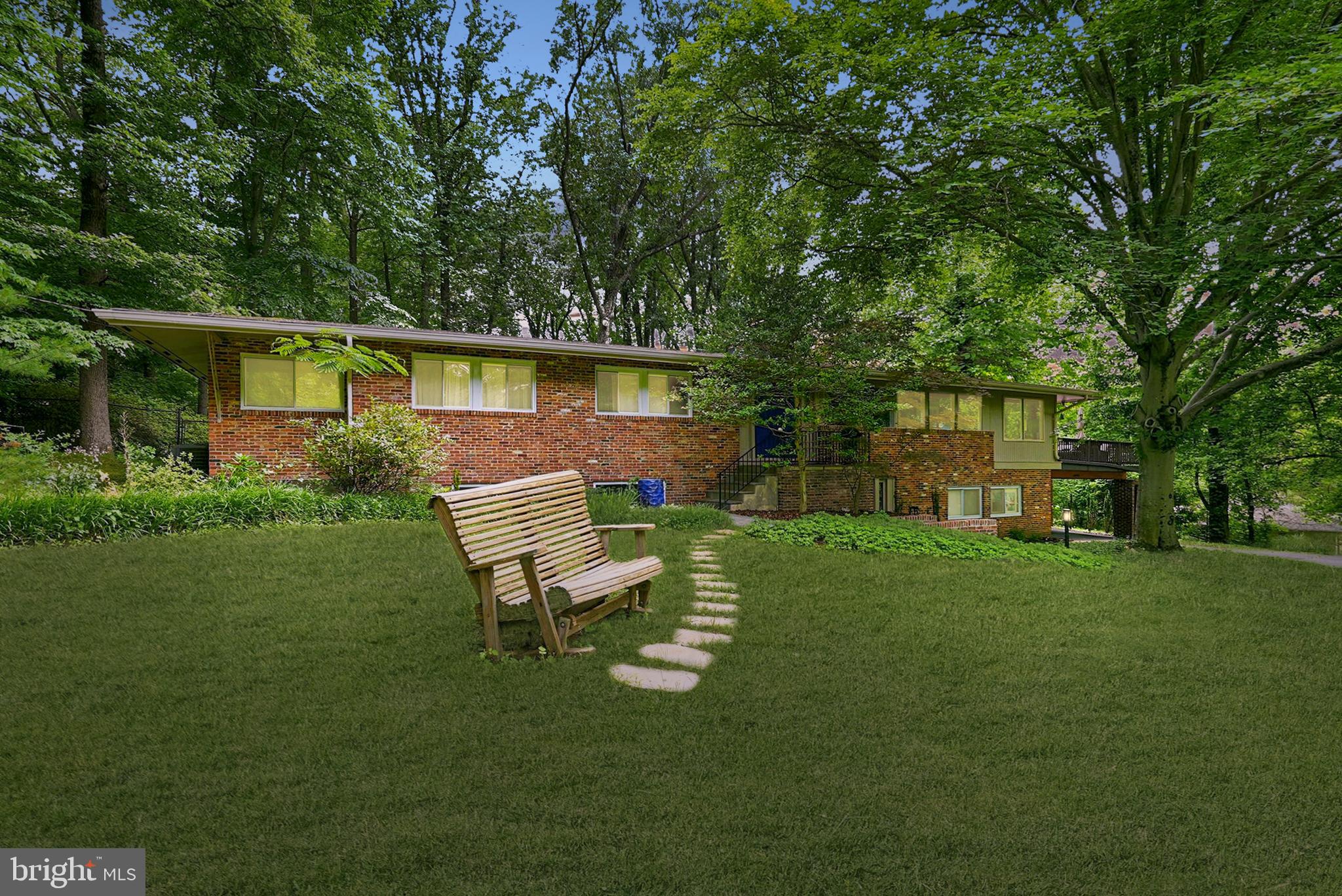 Set on a picturesque .75-acre lot in the heart of Potomac, this exceptional Mid-Century Modern home blends timeless architecture with warmth, character, and thoughtful updates throughout. Spanning just under 4,000 square feet across two levels, the home is filled with natural light and offers an inviting, airy feel from the moment you step inside. A stunning new kitchen completed in 2025 anchors the main level, while the breathtaking sunroom and expansive rear deck create the perfect spaces to relax, entertain, and enjoy the peaceful surroundings.

The dramatic family room showcases soaring vaulted ceilings and striking architectural lines that capture the essence of Mid-Century design. The thoughtful layout offers the ease of everyday living on the main level, where you'll find the spacious primary suite with an ensuite bath, two additional bedrooms, a beautifully renovated hall bathroom, and the home's principal living spaces. The walkout lower level offers exceptional flexibility, with a large recreation room featuring a fireplace, a fourth bedroom, an additional full bathroom, and ample space for guests, work-from-home needs, hobbies, or multi-generational living.

Just as special as the home is its setting. Tucked away on a quiet, tree-lined dead-end street, Farnsworth Drive is one of Potomac's hidden gems. Designed with gently curving roads and mature landscaping, the neighborhood offers a peaceful, park-like atmosphere where homes feel thoughtfully nestled into their natural surroundings. With only 17 homes, the community is known for its welcoming neighbors, neighborhood gatherings, and genuine sense of connection that is increasingly hard to find.

Despite its tranquil setting, the location is exceptionally convenient, just minutes from I-495 and I-270, near the Bethesda and Washington, DC borders, and within easy reach of shopping, dining, parks, and top-rated schools. This is a rare opportunity to own a truly distinctive Mid-Century Modern home in one of Potomac's most unique and desirable enclaves.