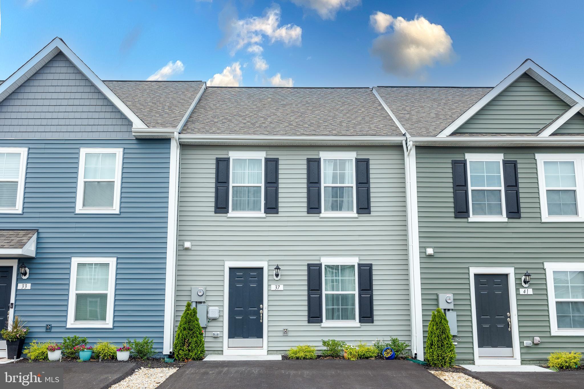 Back on the market through no fault of the seller! Move-in ready townhouse in highly sought-after Whispering Pines! This impeccable home was completed in December 2023 and has been lovingly and gently treated. A recent home inspection report shows the home is in excellent condition. Don't wait for a new build! This better-than-new home is available immediately, and won't last long. A new washer and dryer convey with the property. A new water softener has been added. The kitchen features an elegant tile backsplash and multi-purpose built-in microwave/air fryer/oven/convection oven.