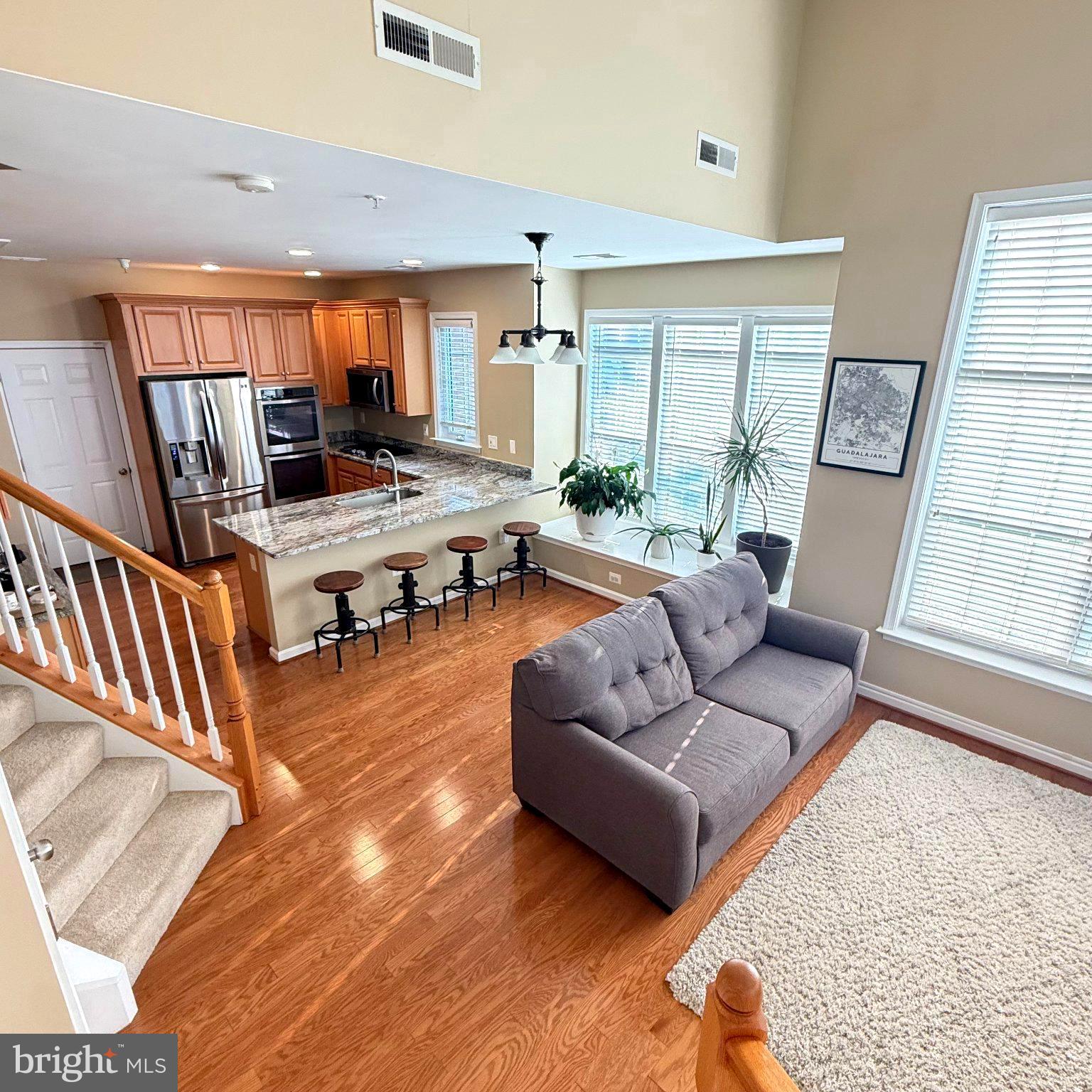 Welcome to this beautifully maintained 2-bedroom, 2.5-bath townhouse style condominium in the desirable Manassas Park Station! This two-level corner unit home offers an open-concept main level with abundant natural light, creating an inviting space for everyday living and entertaining. The upgraded kitchen flows seamlessly into the living and dining areas, while the attached one-car garage provides added convenience and storage. Upstairs, you'll find two spacious bedrooms, each with private access to the large balcony. The primary suite includes a private bath, shower and generous closet space. The second bedroom can serve as a home office.  Enjoy low-maintenance living with community amenities, including an outdoor pool and professionally maintained common areas. Steps away from the newly developed Park Central Plaza with coffee shops, restaurants, movie theatre, farmers market and shopping.  Conveniently located near the Manassas Park VRE Station, Route 28, Route 29, and I-66, commuting is a breeze.