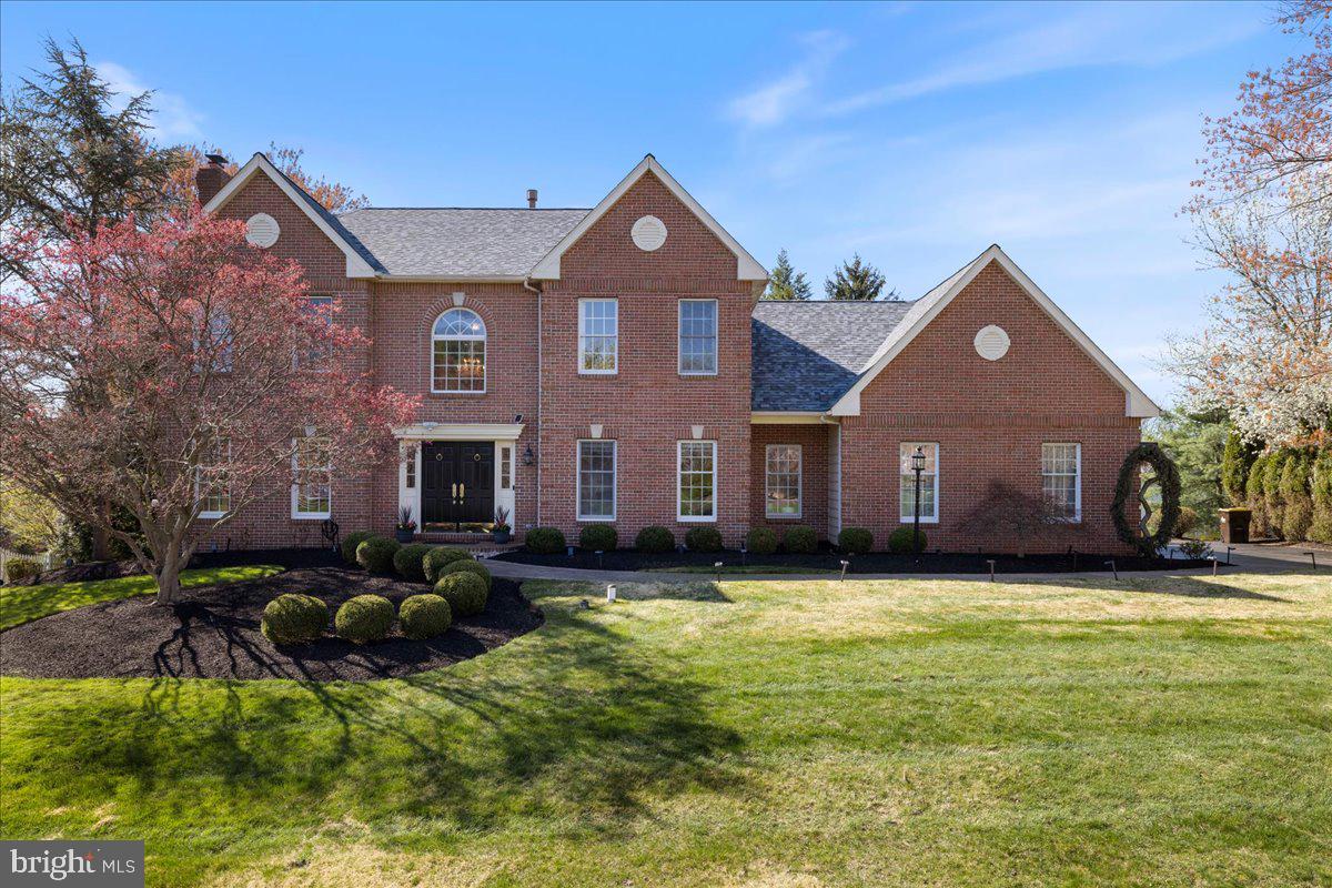 Welcome to a distinguished brick-front Colonial where timeless elegance meets modern sophistication. Meticulously updated and impeccably maintained, this exceptional residence offers a seamless blend of refined design, luxurious comfort, delivering a lifestyle of ease, privacy, and leisure.
A grand two-story foyer sets the tone, adorned with a statement crystal chandelier and rich hardwood flooring that flows throughout the main and upper levels. Thoughtfully designed formal living and dining rooms feature exquisite crown molding, picture frame molding, and designer lighting — creating an atmosphere ideal for both intimate gatherings and grand entertaining.
At the heart of the home, the custom kitchen is a true showpiece. Appointed with granite countertops, a decorative tile backsplash, stainless steel appliances (most under five years old), a built-in wine cooler, and a newly installed statement hood, this space is as functional as it is beautiful. The adjoining breakfast area opens to a newly constructed Trek deck and a charming gazebo—offering a private, serene setting for morning coffee or evening cocktails.
The beautiful family room is bathed in natural light, featuring soaring vaulted ceilings, skylights, and a striking stone fireplace, creating a warm yet sophisticated gathering space. A private first-floor office, elegant powder room with marble flooring, and a well-appointed laundry room add convenience and flexibility.
Upstairs, the owner’s suite is a true retreat, complete with a sitting room, expansive walk-in closet, and a newly reimagined spa-inspired bath. Luxurious finishes include porcelain tile, a freestanding soaking tub, an oversized frameless glass shower, and a dual vanity—designed to evoke a five-star experience. Additional bedrooms are generously sized and complemented by a beautifully renovated hall bath, while new carpeting on the stairs adds a fresh touch of comfort.
The walk-out lower level has been thoughtfully enhanced with luxury vinyl plank flooring, offering versatile space for a home theater, fitness studio, or recreation lounge, along with ample storage.
Recent upgrades—including a new roof with gutter guards and warranty, new gazebo roof, new Anderson windows with warranty, new Trek deck, whole-house humidifier, updated water heater (2020), and integrated Citadel whole house security system with warranty—ensure both peace of mind and modern efficiency.
Perfectly positioned just minutes from the charm of Newtown Borough, residents enjoy easy access to fine dining, boutique shopping, cultural attractions, and major commuting routes to Philadelphia, Princeton, and New York City.
This is more than a home—it is a lifestyle of comfort, elegance, and effortless living.