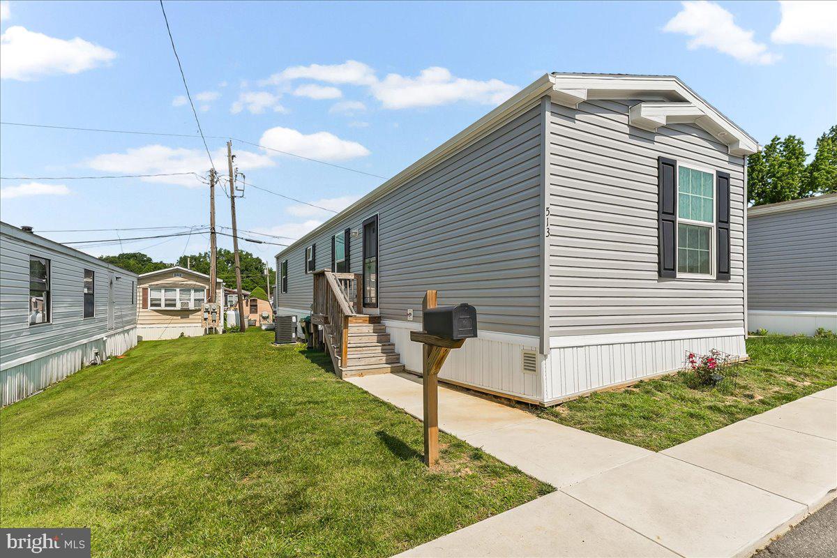 This beautiful home is a 2024 model (14'wide x 64 long), and is in great condition! The common areas feature deluxe, radiant vinyl plank while the bedrooms feature cozy carpet. You are greeted with an open floor plan upon entry to the kitchen and living room with plenty of space for furniture and decoration. The kitchen also has abundant cabinet and counter space, with all appliances included. The front bedroom sports a full hall bath while the back bedroom sits across from a stunning second bathroom with tile and full glass doors. 

As this is a mobile home, conventional mortgages will not be applicable. However, special financing, a personal loan, or cash are all acceptable. The lot rent is just $1003.42 a month, the property taxes are ultra low, and maintaining these homes is extremely affordable.

This house is ready to be someone's home! Reach out today.