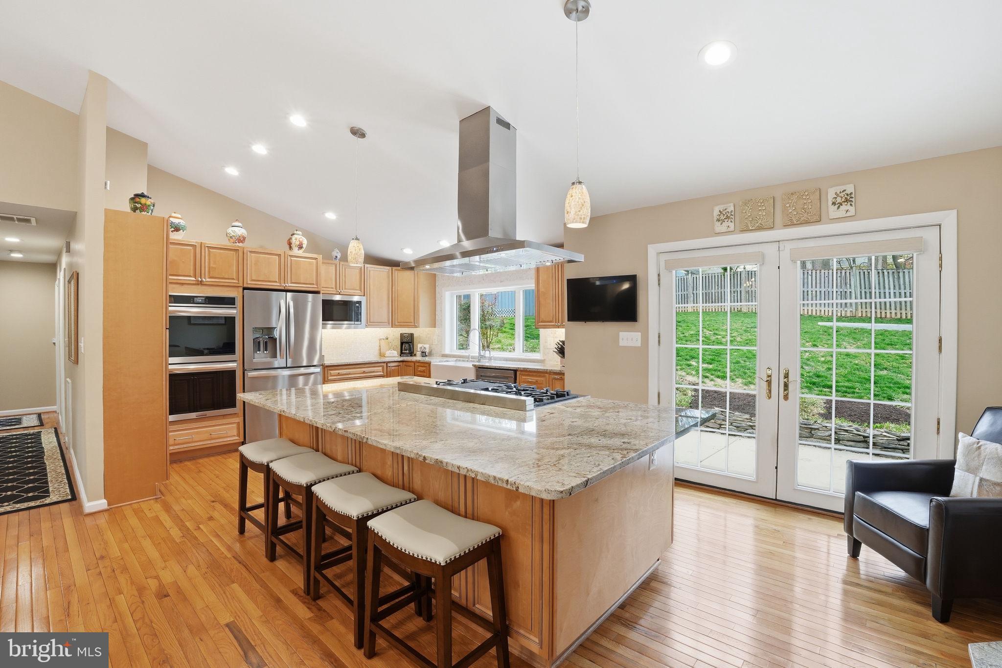 Rarely available & extensively renovated! This stunning Silver Spring home was reimagined in 2023 with a "down-to-the-studs" transformation, blending high-end designer finishes with unmatched structural integrity.
Chef’s Dream Main Level: Step into an open-concept masterpiece featuring soaring cathedral ceilings and gleaming new hardwoods. The gourmet kitchen is a showstopper, anchored by a massive 9' granite island and equipped with a 48" professional 6-burner gas cooktop with griddle, double-wall ovens, and premium cabinetry.
Versatile Lower Level: The fully finished walk-out level offers incredible flexibility as an in-law suite or premium entertaining hub. It features a second kitchenette with an 8' granite island, a two-zone wine fridge, a 4th bedroom/office, and a remodeled full bath.
Exceptional Infrastructure & Exterior: Peace of mind comes standard with a NEW roof (trusses, sheathing, and architectural shingles), new Hardie fiber-cement siding, and a 20kW whole-house standby generator to ensure you're never without power. Enjoy the new concrete driveway, 6" oversized gutters with guards, and a 10’x16’ storage shed.
Prime Location: Nestled in a quiet enclave just 1.5 miles from the Glenmont Metro (Red Line). Nature lovers will adore being 1 mile from the world-class Brookside Gardens and Wheaton Regional Park, while commuters enjoy instant access to the ICC and I-495.