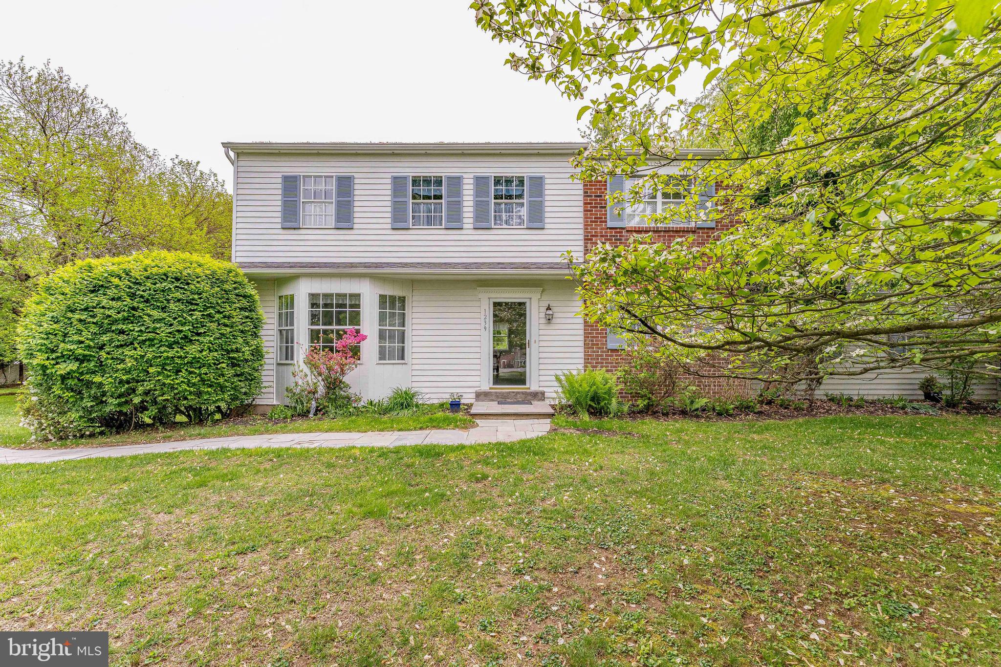 Welcome to 1239 Upton Circle, a 4-bedroom, 2.5-bath single-family home in the Goshen Downs community of West Chester. Situated on a private one-acre lot with mature trees, this home offers a quiet setting with no HOA and plenty of space to enjoy. A large driveway provides ample parking for multiple vehicles. Inside, the living room features carpet flooring and a bay window overlooking the front yard. Just off the living room, the dining room includes a double window and offers a comfortable space for gatherings. The kitchen features tile flooring, white cabinetry, and a peninsula, and opens to the breakfast area with views of the backyard. The family room provides a cozy setting with a floor-to-ceiling brick wood-burning fireplace and direct access to the backyard, making it an ideal space to relax or entertain. Down the hallway, you’ll find a laundry room with tile flooring, a washer and dryer, a closet, and access to a convenient powder room. A standout feature of this home is the private in-law suite. This space includes a bonus room with tile flooring, a semi-vaulted ceiling, skylights, and access to the backyard, perfect for a separate living area. The suite also includes a bedroom with carpet flooring and an en-suite bathroom with tile flooring, a skylight, and a step-in shower. All the skylights open with screens! Upstairs, the primary bedroom offers carpet flooring, a walk-in closet, and an en-suite bathroom with tile flooring and a tub and shower combination. Three additional bedrooms on this level provide flexible space for family, guests, or a home office. A full hall bathroom and linen closet complete the second floor. The unfinished basement houses the home’s utilities and offers the potential to be finished for additional living space. Conveniently located near Hershey’s Mill Golf Club, East Goshen Township Park, and a variety of local shopping, dining, and everyday amenities, this home offers both privacy and accessibility. Don’t miss the opportunity to make 1239 Upton Circle your new home.