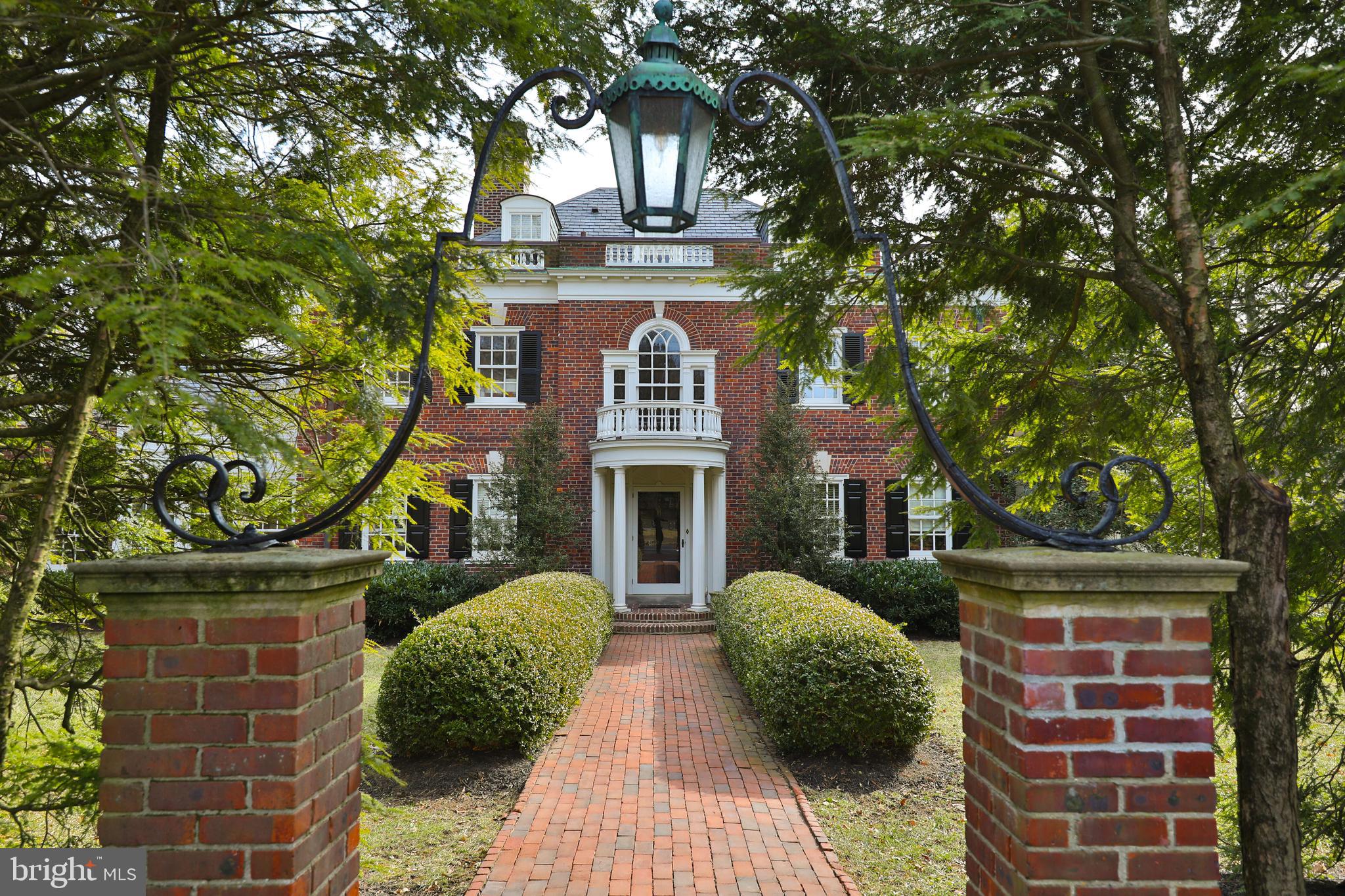 This 1937 Georgian Colonial in West Mount Airy is a perfect blend of historic elegance and modern sophistication, offering timeless architectural details alongside contemporary updates designed for today’s lifestyle. Located  blocks from Carpenter's Woods and the miles of trails in the Wissahickon Valley, this five-bedroom, four full and three half-bathroom estate has been completely remodeled, preserving its original character while incorporating high-end finishes and thoughtful design.

There is abundant first floor living space, beginning with a grand foyer and sweeping staircase that sets the tone for the home’s elegance. The open-concept kitchen features soapstone countertops, a breakfast nook, and a spacious pantry, making it both stylish and functional. Adjacent to the kitchen, the family room provides a comfortable gathering space, while the formal dining room and living room with a fireplace create the perfect setting for entertaining. A private office with custom-built cabinetry, a sunroom filled with natural light, and a half bathroom complete the main level.

On the second floor, the primary suite is a true retreat, featuring a dressing room with custom cabinetry and a spa-like ensuite bath with a clawfoot soaking tub and walk-in shower. A private guest room offers another beautifully remodeled ensuite bath. Two additional bedrooms share a Jack-and-Jill bathroom, and a bonus room, currently set up as an office, provide additional flexibility.

The third floor is a newly remodeled private suite, complete with a spacious bedroom, a beautifully designed bathroom with a soaking tub and walk-in shower, and a large walk-in closet with custom cabinetry. Throughout the home, ample storage space is thoughtfully integrated with custom-built cabinetry and closets, ensuring both functionality and style.

Outside, the sprawling grounds are beautifully landscaped with mature plantings, enhancing the home’s stately presence. A large slate patio at the rear of the home offers an ideal space for outdoor entertaining, while the long, freshly paved driveway leads to a one-car garage. Move right into this stunner featuring hardwood floors throughout, five fireplaces, custom built-ins, and central air conditioning. Every detail has been carefully considered to honor the home’s history while providing the comfort and style of modern living.