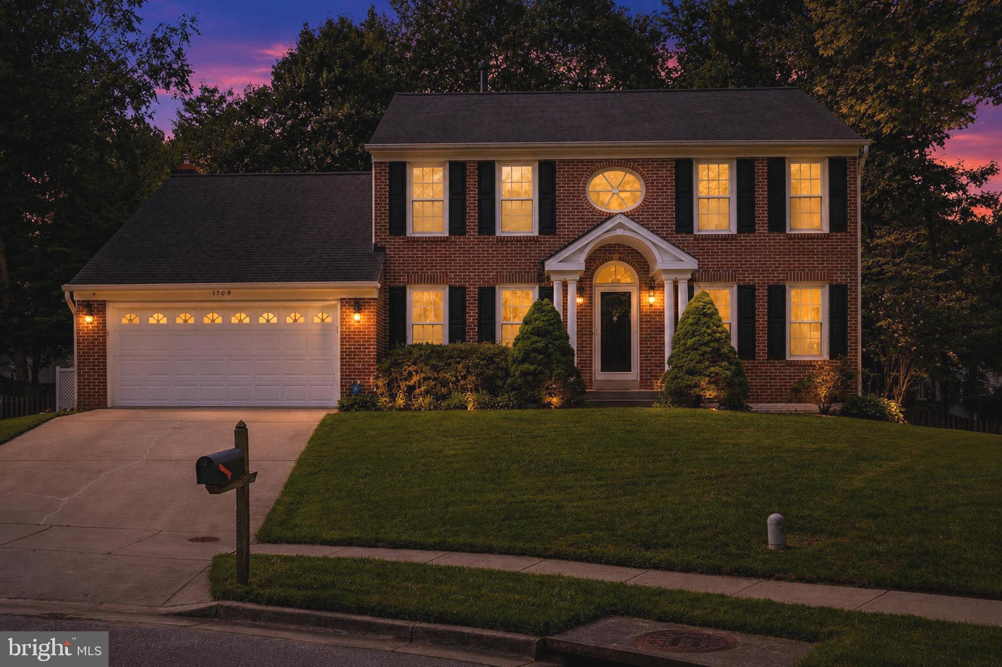 Perfectly positioned at the end of a cul-de-sac in the coveted Crofton Chase community, this timeless brick-front colonial exudes classic elegance and offers over 3,000 square feet of beautifully maintained living space with 4 bedrooms, 3.5 bathrooms, a two-car garage, and almost a quarter acre of land! The impressive two-story foyer introduces a traditional floor plan featuring beautiful hardwood flooring throughout the main level, a spacious formal living and dining room, and a large sunken family room highlighted by soaring vaulted ceilings, a cozy fireplace, and multiple doors opening to the expansive deck and private backyard. The updated kitchen serves as the heart of the home, featuring stainless steel appliances, double wall ovens, a new gas cooktop, a large center island with bar seating, 42-inch wood cabinetry, a double pantry, and a dedicated coffee/bar area with abundant storage. The adjoining breakfast area opens seamlessly to the family room, creating the ideal space for gathering and entertaining. The main level also includes a spacious mudroom with laundry, an oversized powder room, and convenient access to the attached two-car garage. Upstairs, the spacious primary suite features vaulted ceilings, walk-in closet, and a large en-suite bathroom with a double vanity, soaking tub, and separate walk-in shower. Three additional generously sized bedrooms, including one with custom built-in shelving, and a full hall bath complete the upper level. The finished walkout lower level offers nearly 700 square feet of additional living space, ideal for a recreation room, home office, gym, or guest suite, along with a full bathroom and an enormous storage area. Situated on a beautifully landscaped lot with mature trees, this exceptional location is within walking distance of Crofton Elementary School, the Crofton Library, and the popular Crofton Farmers Market. Enjoy access to a tucked-away neighborhood park featuring basketball courts, volleyball, a gazebo, and scenic ponds with ducks and geese. Zoned for Crofton Elementary, Crofton Middle School and Crofton High School, with convenient access to Fort Meade, Annapolis, Washington DC, and the shopping, dining, and entertainment of Waugh Chapel Town Centre. Here's your chance to own an elegant, meticulously maintained home in one of Crofton's most sought-after neighborhoods! Come see this home today!