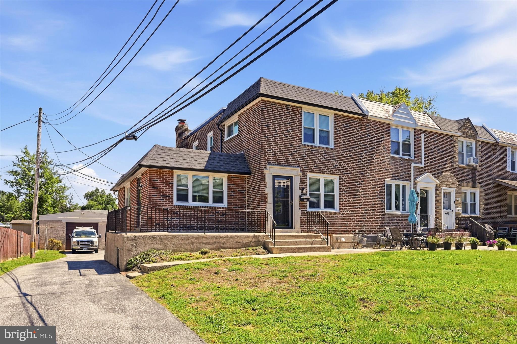 18 W. Madison Avenue / Clifton Heights, PA 19018

Welcome to a truly exceptional, fully renovated home with 3-4 Bedrooms,2 full Bathrooms and 1 Powder room where modern design, quality craftsmanship, and everyday convenience come together seamlessly. Situated on an oversized lot in the heart of Clifton Heights, this stunning exterior rowhome/townhouse has been completely transformed from top to bottom during its comprehensive 2025-2026 renovation, offering the rare opportunity to own a move-in-ready home with virtually everything brand new.
From the moment you arrive, you’ll appreciate the impressive curb appeal, highlighted by a welcoming front porch-the perfect place to enjoy your morning coffee, unwind after work, or greet neighbors on a beautiful day.
Step inside and prepare to be impressed. The spacious interior boasts over 1 ,500 square feet of beautifully reimagined living space featuring an open and airy floor plan designed for today's lifestyle. Brand-new luxury vinyl flooring flows throughout the main and lower levels, while plush new carpeting adds comfort and warmth upstairs.
The heart of the home is the spectacular designer kitchen. Bathed in natural light from surrounding windows, this stunning space features custom soft-close upper and lower cabinetry, elegant granite countertops, a large center island, brand-new stainless-steel appliances, and a bright dinette area perfect for casual meals, morning coffee, or entertaining family and friends. The open-concept design creates effortless flow throughout the home and makes everyday living both comfortable and functional.
Just beyond the kitchen, you'll find an expansive family room anchored by a beautiful gas fireplace, creating a warm and inviting atmosphere for gatherings, holidays, and cozy evenings at home. A separate large living room with a private Powder Room provides additional flexible living space to accommodate today's busy households.
The second floor offers three generously sized bedrooms and a beautifully updated full bathroom. The finished lower level adds incredible versatility with a private fourth bedroom, a second full bathroom, and an ideal setup for in-law quarters, guest accommodations, a home office, fitness room, or extended living space.
The list of improvements is extensive and provides exceptional peace of mind tor years to come, including:
•