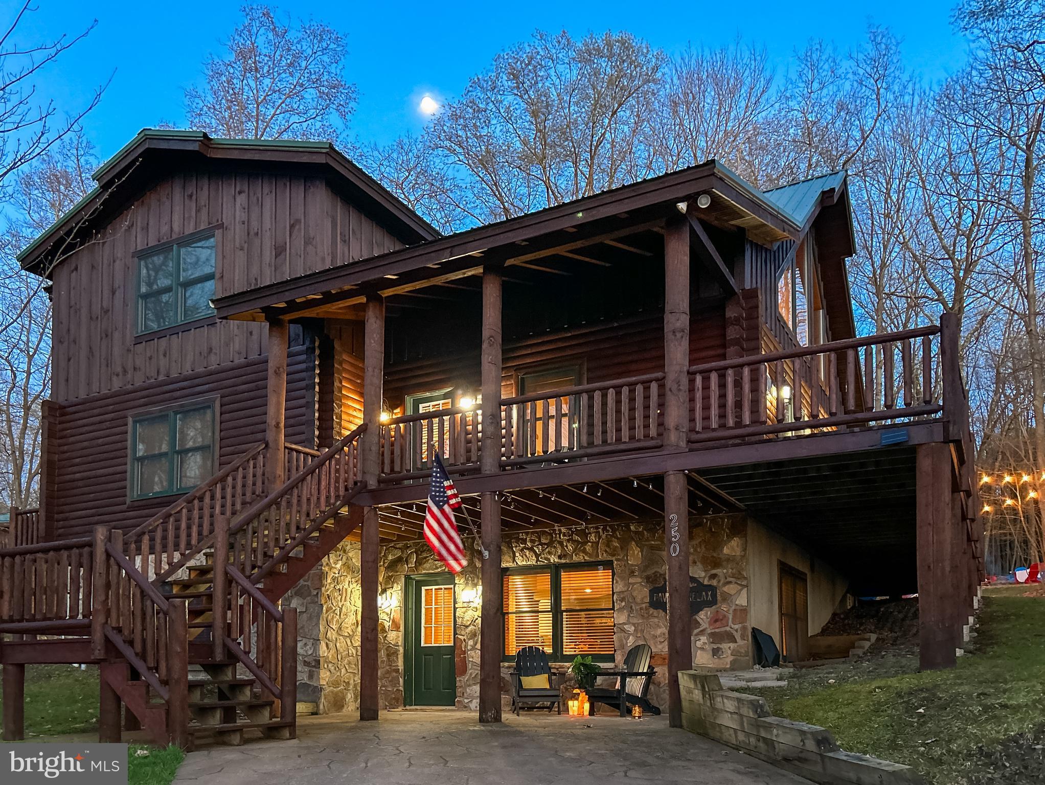 Immaculate 4-bedroom log home in the highly sought after Gallatin Woods community. Custom built with custom finishes throughout. Granite counters, hardwood floors, 2 fireplaces, extensive hardscaped patio and outdoor fireplace, and the list of upgrades literally goes on and is available on request for the discerning buyer. Minutes from Deep Creek Lake and all of the area amenities yet tucked away in a log home community.