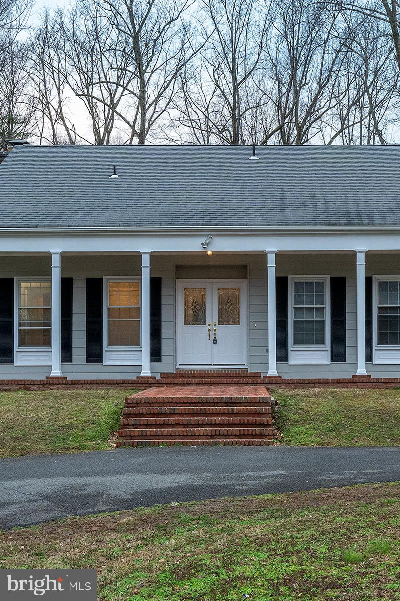 YOU MUST SEE this  5,206 sqft house, much larger than it appears.  Has a master suite on the 1st floor, 4 other bedrooms, and a spacious family room with a fireplace.

This charming Cape Cod home sits on a picturesque, nearly 3-acre lot in a peaceful, family-friendly neighborhood. The main level boasts gleaming hardwood floors, chair rails, and crown molding. The chef's kitchen features granite countertops, double ovens, a gas cooktop, an island, recessed lighting, and ample table space. Enjoy the formal dining room, as well as the living and family rooms, both adorned with cozy wood-burning fireplaces. A bedroom with a walk-out terrace adds to the main level's allure.

The upper level offers a luxurious Grand Master Suite with a sitting area, two walk-in closets, an additional fifth bedroom, and a full bathroom. The finished lower level is an entertainment haven, including an open media and game room, a home gym, and extra storage. The large recreation room in the basement opens to the backyard. Additionally, the septic was pumped in February 2024.

Outdoor living is a delight, with multiple spots to relax and entertain on the partially covered, expansive back deck or charming front porch. The property, surrounded by mature trees, provides lots of open space for children or pets to play. Ample parking is available in the oversized circular driveway. Enjoy the convenience of an easy commute to PAX Naval Base, Beltways, and DC. Don't miss the opportunity to make this your dream home!