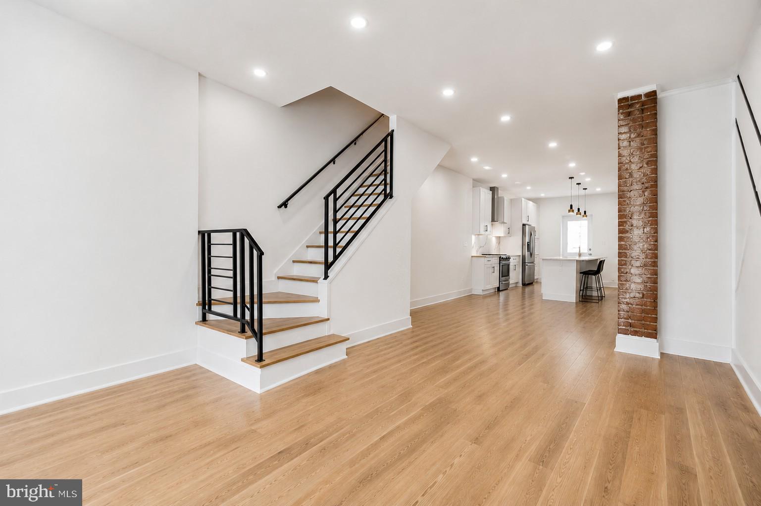 Welcome to 1718 S. 18th Street, a stunning custom renovation in the highly sought-after Newbold section of South Philadelphia, with exceptional modern finishes throughout. Highlighting approximately 6 years remaining on the improved value tax abatement, the new buyer will receive significant additional savings. This extra-wide, three-story home features 3 bedrooms, 3.5 baths, including two en-suite bedrooms, soaring ceilings, wide-plank solid oak flooring, and abundant natural light.
Designed for modern living and entertaining, the open-concept main level offers a beautifully appointed kitchen with ample cabinetry and storage, a stylish powder room, and seamless access to a spacious rear patio finished in new concrete. The second-floor features two spacious bedrooms, two full baths, a convenient laundry, and a custom wet bar. The entire third floor is dedicated to the primary suite, complete with a spa-inspired bath featuring an oversized shower, double vanity, and direct access to a bi-level Trex roof deck with breathtaking 360-degree skyline views.
Additional highlights include a fully finished, waterproofed basement with a French drain system and egress, two-zone high-efficiency HVAC, smart thermostats, abundant closet space in every room, which is a rarity in a townhouse, two washer/dryer hookups, and a SimpliSafe security system. Ideally located near the Broad Street Line, East Passyunk, and neighborhood favorites including Ultimo Coffee, South Philly Tap Room, Hardena, and Second District Brewing, this home offers the perfect blend of space, style, and convenience in one of Philadelphia’s most vibrant neighborhoods.