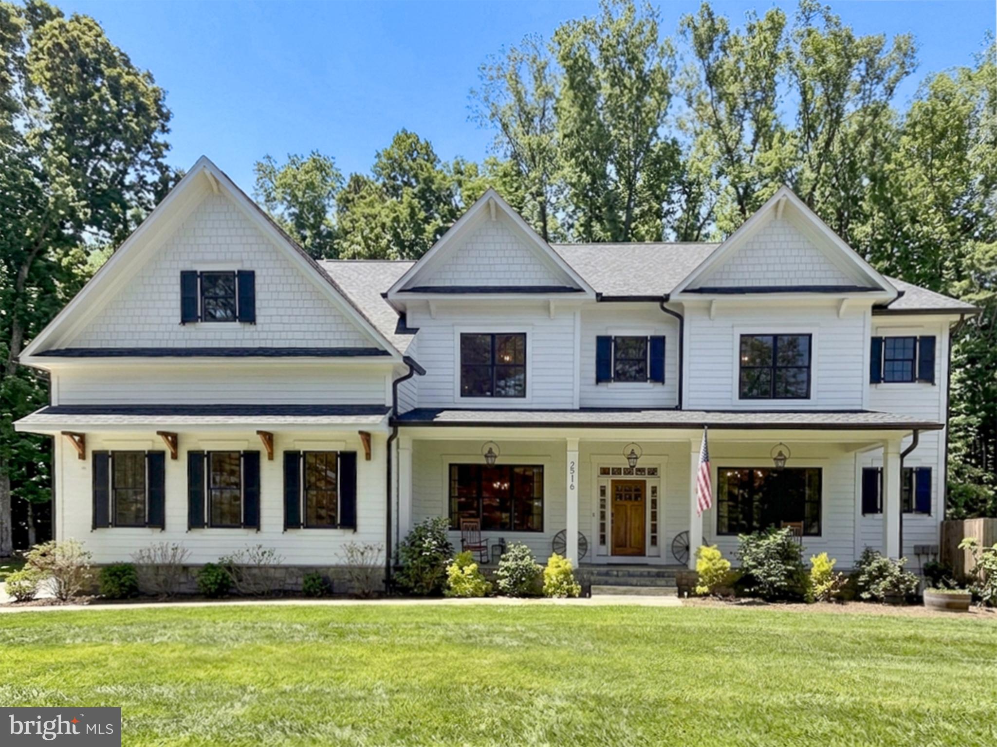 *** Open House, Sunday, July 5th 1 PM-3 PM ***

Tucked away on a quiet cul-de-sac in one of Vienna’s most desirable locations, this custom-built 2020 Reel Homes masterpiece offers an exceptional blend of timeless craftsmanship, modern convenience, and retreat-style living. Situated on a beautiful, flat lot with a private wooded backdrop, this extraordinary 7-bedroom, 7.5-bath residence provides the rare opportunity to enjoy expansive outdoor living spaces without feeling surrounded by neighboring homes.

Designed for both everyday living and unforgettable entertaining, the thoughtfully crafted floor plan flows effortlessly from one space to the next. Gather with family and friends on the inviting front porch illuminated by charming gas lanterns, host game days and summer evenings on the covered rear porch with its outdoor fireplace and TV, or enjoy the shaded backyard retreat that remains comfortable even during warm summer afternoons. The fully fenced yard offers endless space for play, gardening, pets, and outdoor activities.

At the heart of the home is a stunning gourmet kitchen designed to bring people together. Featuring an expansive center island, quartz countertops, and premium Thermador stainless steel appliances, this beautifully appointed space seamlessly blends style and function, making it equally suited for casual family meals, large gatherings, and effortless entertaining.

Inside, every detail was carefully selected with an emphasis on enduring quality and classic design. 5-inch character oak flooring, custom wainscoting and millwork, designer lighting, and hand-selected tile create an atmosphere that is both sophisticated and welcoming. The thoughtfully designed layout offers exceptional flexibility for today’s lifestyle, providing abundant space for multigenerational living, long-term guests, an au pair suite, or evolving household needs. A beautifully designed mudroom serves as the perfect everyday drop zone, blending practicality with the home’s elevated design aesthetic.

The luxurious primary suite serves as a private retreat, featuring a cozy fireplace and a spa-inspired bath with heated floors and a timeless claw-foot soaking tub, creating a peaceful sanctuary to unwind and recharge.

For hobbyists and enthusiasts, this property is truly one of a kind. The temperature-controlled garage features three bays with 220-volt electric vehicle charging in each stall, a 7,000-pound lift capable of storing a fourth vehicle, and a 120-gallon air compressor. The lower-level golf simulator room creates the ultimate year-round practice space, while the custom deer-proof raised garden with over 350 square feet of planting beds, drip irrigation, mature fruit trees, and perennial edibles offers an extraordinary opportunity to cultivate your own private garden oasis.

Additional highlights include a fully irrigated yard with smart Rachio controls, landscape lighting, extensive professional tree care, plus public water and sewer services.

Perfectly positioned, the home offers the best of Vienna living with remarkable convenience. Steps to Flint Hill Elementary and Madison High School, enjoy direct access to the neighborhood playground and fields via the cul-de-sac path, and appreciate being just minutes from the Vienna Metro, I-66, downtown Vienna, and numerous private schools. Enjoy all the benefits and proximity of Vienna while residing outside town limits, avoiding additional Town of Vienna property taxes.

This is more than a home, it’s a place designed for gathering, entertaining, pursuing passions, accommodating every stage of life, and creating lasting memories for generations to come.