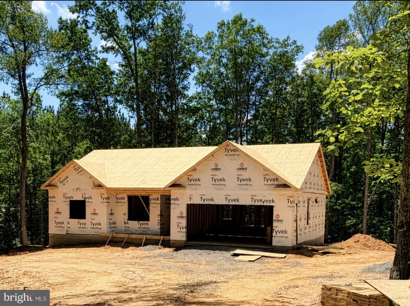 UNDER CONSTRUCTION-MID SEPTEMBER COMPLETION- CHARLESTON II MODEL - LOT 10- Located on a lovely 2.101 acre mostly wooded lot. Home will include an open floor plan with Stainless Steel Appliances and Granite Counter Tops in kitchen, Cultured marble vanity tops in the bathrooms, Covered front porch, Unfinished Basement with bathroom rough-in for future expansion and a 2 car garage. Still time to make your selections! Call for more information or to schedule a showing! Road Maintenance Agreement. ** FYBERLYNC Available! Please call Fiberlync for more information and confirmation.