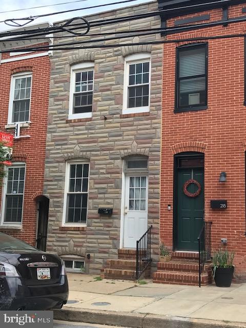 Great starter home or renovation potential.  Priced to go quickly. Private parking pad in rear. Hardwood floors.  Gas cooking. Sold AS-IS.