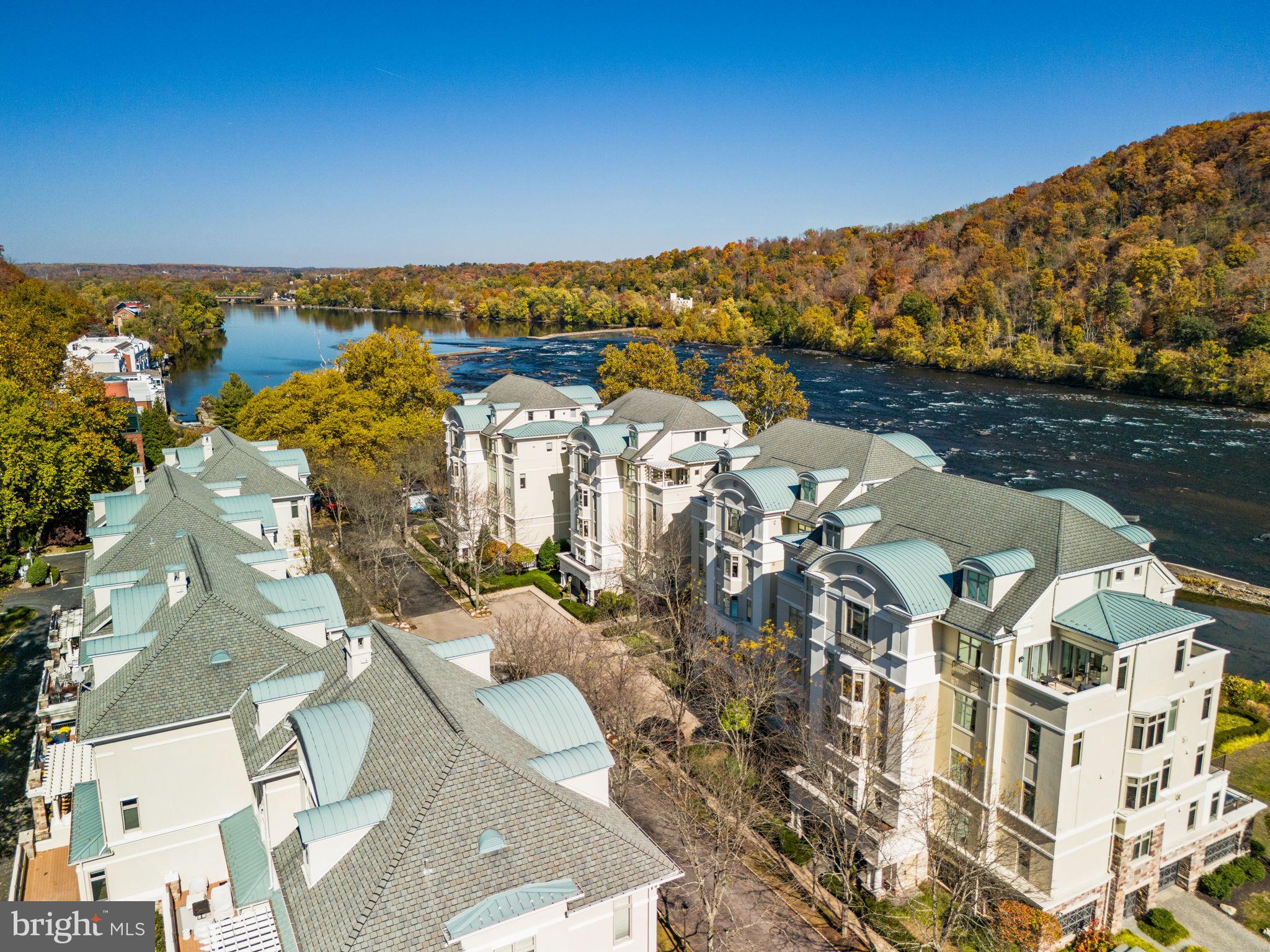 Luxury lifestyle awaits at Waterview Place on the Delaware River. This beautiful stately townhome in the prestigious gated Waterview Place Condominiums charms at the water’s edge with European style courtyard, water fountain, and professional landscaping. A private covered entryway leads to four levels of finished living space, easily accessible with a private wood-paneled elevator. You’ll enjoy 3 spacious bedrooms, 3 1/2 baths, a fourth bedroom currently being used as an office, & a comfortable open floor plan. The large living room/great room enjoys ten-foot ceilings, beautiful light, hardwood floors, wide crown molding, gas fireplace and recessed lighting. Freshly painted throughout, this home is move-in ready. The living room is open to a dining area w/built-in cabinetry & access to a private deck overlooking the canal. This long deck invites you to relax and take in the tranquil scenery, a perfect spot for morning coffee or evening night cap. Cook's kitchen w/maple cabinetry, granite counters, stainless Dacor appliances & Subzero refrigerator. Massive main bedroom suite w/sitting area, full bath w/whirlpool tub, oversized shower & 2 walk-in closets. The entire sun-filled suite takes full advantage of the views. Nearby a laundry room provides extra sink and storage. Two generously sized suites, each with walk-in closet and private bath, plus a large office share the third floor with spacious nine-foot ceilings. A windowed lower level is perfect for a family room, gym or office, with interior access to a 2-car attached garage & ample storage. Walk-in closets & oversized windows & doors throughout. An easy walk to New Hope, this condo is pet-friendly, has generous parking for guests, is in the top rated New Hope-Solebury School District, and is just a mile from the heart of New Hope with all its unique shops, eateries, galleries and the Bucks County Playhouse. An inspiring lifestyle and rare opportunity to be in the heart of the very best of New Hope.

All information in this description has not been verified and is not guaranteed. Prospective buyers should conduct their own due diligence.