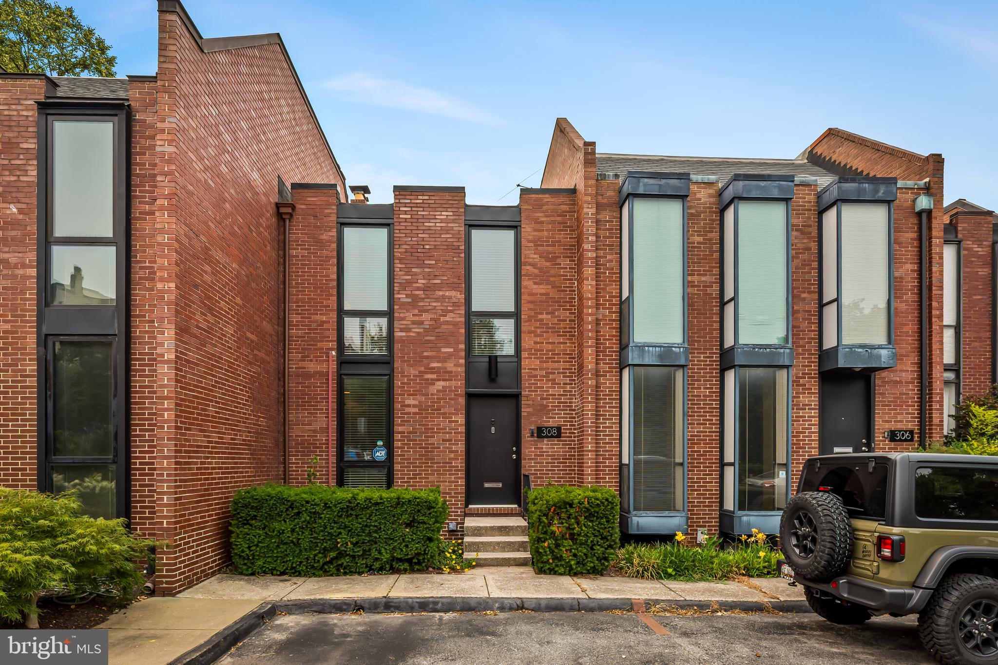 Showings begin Tuesday, July 28th. 

A Mid Century Modern icon with a secret garden in the heart of Baltimore. Designed in 1968 by internationally acclaimed architect Hugh Newell Jacobsen townhouse in Bolton Square combines clean architectural lines, original MCM details, exceptional natural light, and sophisticated contemporary living in historic Bolton Hill.

The open main level features an updated kitchen with stainless steel appliances and a spacious living and dining room combination with sparkling parquet flooring original to Jacobsen's design. Dramatic floor to ceiling windows overlook a private patio and lush, fully fenced garden oasis, creating a seamless connection between indoor and outdoor living.

The second floor offers two light filled bedrooms with generous closet space and a full bathroom. The newly finished lower level provides valuable bonus living space ideal for a guest room, family room, playroom, creative studio, home gym, or dedicated work from home office. This level also includes a new full bathroom, laundry room, and additional storage. Freshly painted throughout, this architect designed home is truly move in ready.

Two assigned off street parking spaces are conveniently located directly in front of the home. Residents also enjoy access to Bolton Squares private, gated community greenspace with mature landscaping, tranquil water features, and walking paths.

Bolton Hill is a close knit neighborhood where people know their neighbors, appreciate remarkable architecture, and embrace city living. Enjoy an impromptu glass of wine with neighbors, doubles tennis at the Bolton Hill Swim and Tennis Club, neighborhood dog meetups, book clubs, garden clubs, and annual traditions including Festival on the Hill, Concerts in the Parks, the community yard sale, Easter egg hunt, and John Street Park pumpkin carving.

CookHouse, Alma Cocina Latina, Foraged, and Le Comptoir du Vin are all a quick jaunt away. Grab coffee or lunch at On the Hill Cafe or Llamas Corner, hear the Baltimore Symphony Orchestra at the Meyerhoff, see a performance at The Lyric, or catch an independent film at The Charles Theatre.

Penn Station provides convenient MARC Train service to Washington, D.C., and Amtrak service to Philadelphia and New York City. The Johns Hopkins Shuttle connects to the Homewood and East Baltimore campuses, while Light Rail offers access to Orioles and Ravens games and BWI Airport. I 83 and I 95 are also easily accessible.

This is a rare opportunity to own a Hugh Newell Jacobsen home offering Mid Century Modern design, contemporary interiors, private outdoor space, two car parking, flexible work from home space, and one of Baltimores most connected neighborhood lifestyles. Welcome home.