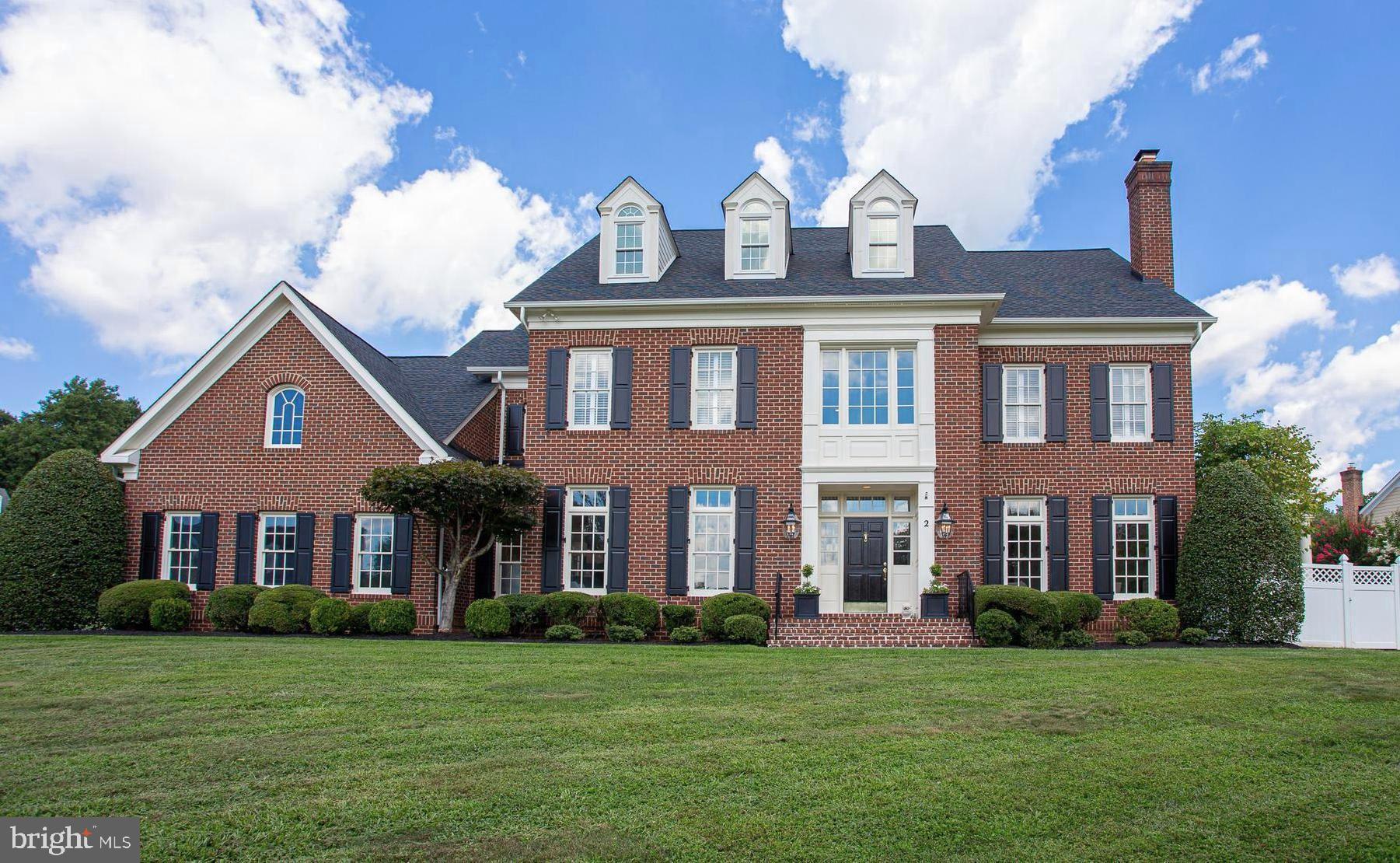 Move in ready and what you have been waiting for!  Sited on almost a half acre, this brick colonial offers 10 foot ceilings on the main floor, four finished levels, six bedrooms and 6 and half baths with a finished fourth level with a full bath for another bedroom or an office. The most recent upgrades include a renovated kitchen with Quartz countertops, top of the line Jenn Air appliances, a gorgeous, marble owner's suite and a recently replaced roof.  The main level is open and airy with a two story foyer, large open kitchen with table space, bar area with separate ice maker, stone fireplace, dual staircases, large mudroom and a relaxing sunroom off the family room.  The lower level features an additional bed and bath and large recreation room.  Don't miss this one!  OPEN SUNDAY 1-4PM  .  FIRST SHOWINGS WEDNESDAY 5PM