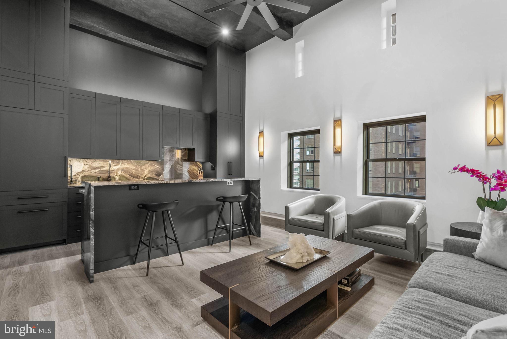 A rare opportunity to own a fully reimagined residence steps from Rittenhouse Square. This stunning bi-level, 2-bedroom, 2.5-bath home at Parc Rittenhouse has been completely transformed with elevated design and carefully curated luxury finishes. Every inch was reimagined with purpose, creating flow, function, and intention. Whether you're searching for a full-time residence, a refined pied-à-terre, or a lock and leave lifestyle, this property offers an exceptional balance of craftsmanship, convenience, and modern sophistication. The main level features an open layout ideal for both everyday living and entertaining. Both bedrooms offer ensuite bathrooms along with thoughtfully designed, high quality built in closets. Oversized windows invite abundant natural light, a constant reminder of the iconic neighborhood just beyond your door. This is the best of Rittenhouse: a premier address with walkability to Michelin dining, boutique shopping, fitness studios, and the Square just outside your door. A rare offering where renovation, design, and location meet. This is city living, simplified and stunning! A parking license for the building is available for an additional $100,000.