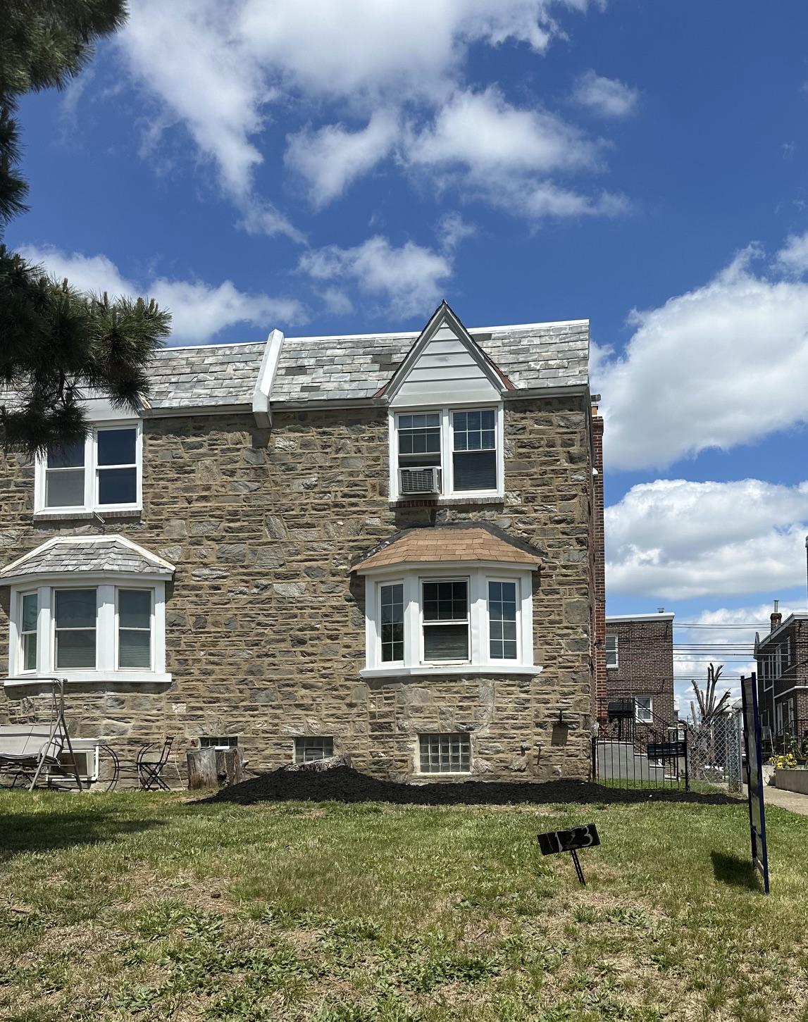 Welcome to this remodeled stone and brick Straight-Thru Twin located on a great block in Northeast Philadelphia! This move-in ready home features 3 bedrooms, 1 full bath, and 1 half bath, along with a nice-sized front yard offering great curb appeal with enough room to park on both sides of the street. Step inside to find natural sunlight beaming onto the freshly stained hardwood floors throughout the main and upper levels, recessed lighting across the first floor, and a bright, modern layout. The updated kitchen features quartz countertops, brand-new SS appliances, and stylish marble accents throughout. Upstairs offers three comfortable bedrooms and a fully updated hall bath with marble tile throughout. The finished basement adds valuable living space along with a convenient half bath along with laundry area and rear garage entry. Conveniently located near shopping, transportation, schools, and major roadways — this is one you do not want to miss!