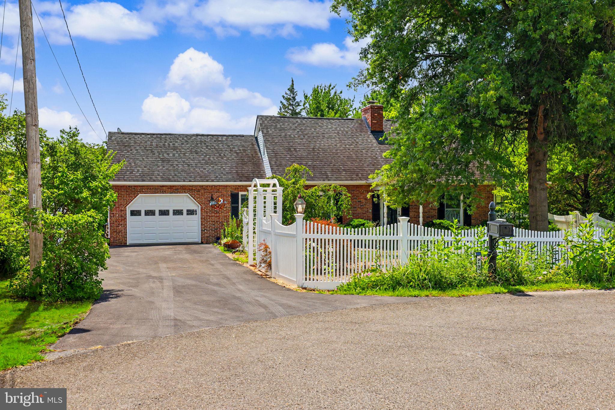 Welcome to this beautifully maintained brick Cape Cod, tucked away on a private 0.70-acre cul-de-sac lot in Middletown! Thoughtfully updated and meticulously cared for, this home offers the perfect blend of charm, comfort, and outdoor living.

Step inside to find fresh interior paint, hardwood floors, updated bathrooms, and a spacious living room featuring a new gas fireplace with thermostat and remote, creating a warm and inviting gathering space. The 20' x 10' sunroom is the perfect place to relax while enjoying peaceful views of the beautifully landscaped backyard. The main-level primary bedroom provides convenient one-level living.

Outside is where this property truly shines. The professionally landscaped front yard features a beautiful picket fence with decorative arch, weeping cherry tree, Japanese maple, azaleas, and a raised stone flower bed connected by a charming brick walkway. Garden enthusiasts will appreciate the established butterfly garden, raised garden beds, and mature asparagus. The fully equipped chicken coop is ready for your flock, while the yard attracts abundant wildlife, creating a peaceful country setting.

Additional highlights include an oversized one-car garage with floored storage above, an outbuilding/workshop with wood stove (plus a cord of seasoned split firewood), Andersen windows, a new insulated garage door, and owned solar panels that convey free and clear, helping reduce utility costs.

For added peace of mind, the sellers have completed a pre-sale home inspection, addressed the noted items, and recently installed a new chimney cap. A new Samsung washer and the sauna also convey with the home.

Located at the end of a quiet cul-de-sac, this move-in-ready home offers exceptional privacy, beautiful landscaping, and countless thoughtful updates—making it a rare opportunity in the Middletown area.