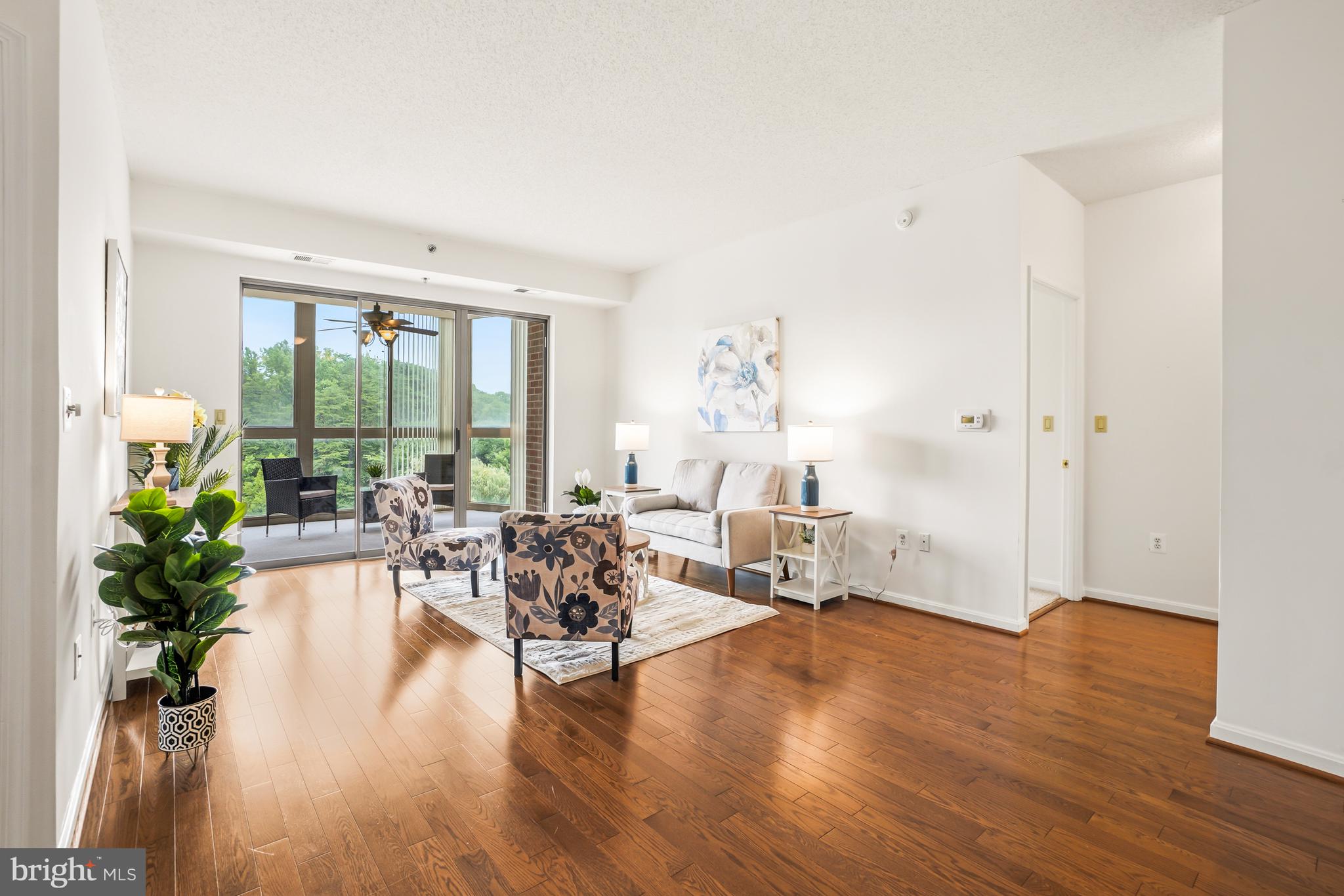 $16,000 Price Improvement. Buyers Delight. Welcome to this light-filled and spacious 2BR/2BA Condo in Leisure World's sought-after 55+ gated community.  This home features luxury vinyl plank flooring and recently installed kitchen appliances. The generously sized kitchen offers abundant cabinetry and preparation space.  New vertical blinds were just installed on the expansive balcony, and carpet was recently installed in both bedrooms. The Gas furnace was replaced in 2024.  Enjoy the expansive living space which flows across the living and dining areas and creates a gracious entertaining area. From the living room you can open the sliding glass doors and expand the living area onto the sunny, bright glass enclosed balcony.   Enjoy the skyline views of the lush green landscape and golf course beyond.  Share your morning beverage with the rising sun. The Primary bedroom suite features a large walk-in closet, and a second smaller closet. The Primary bath has a generously sized glass enclosed walk-in shower and an additional bathtub/shower combo. The second bedroom suite features a full bath with tub/shower combo. There is, also, a very spacious laundry room with side-by side washer/dryer and extra storage shelving.  The condo includes a separate storage cage in the lower-level storage room.  As a resident you may enjoy all of the amenities Leisure World has to offer which include 2 clubhouses, restaurants, an 18-hole golf course, driving range, Fitness center, tennis and pickleball courts, and MedStar Health Center.   Additional activities also include walking paths, indoor and outdoor pools, and seasonal community activities.  There are also numerous clubs and activities such as the photography club, the art center, the ceramics center and lapidary club to name a few. The bi-weekly Leisure world Newspaper provides an abundance of community information. The condo fee covers basic cable, internet service, water/sewer, building maintenance, security and additional community obligations.  This is a prime location and offers easy access to the ICC and I-270.  There is a community bus service, a nearby commuter bus lot and Metro bus access is also available at Club House 1.