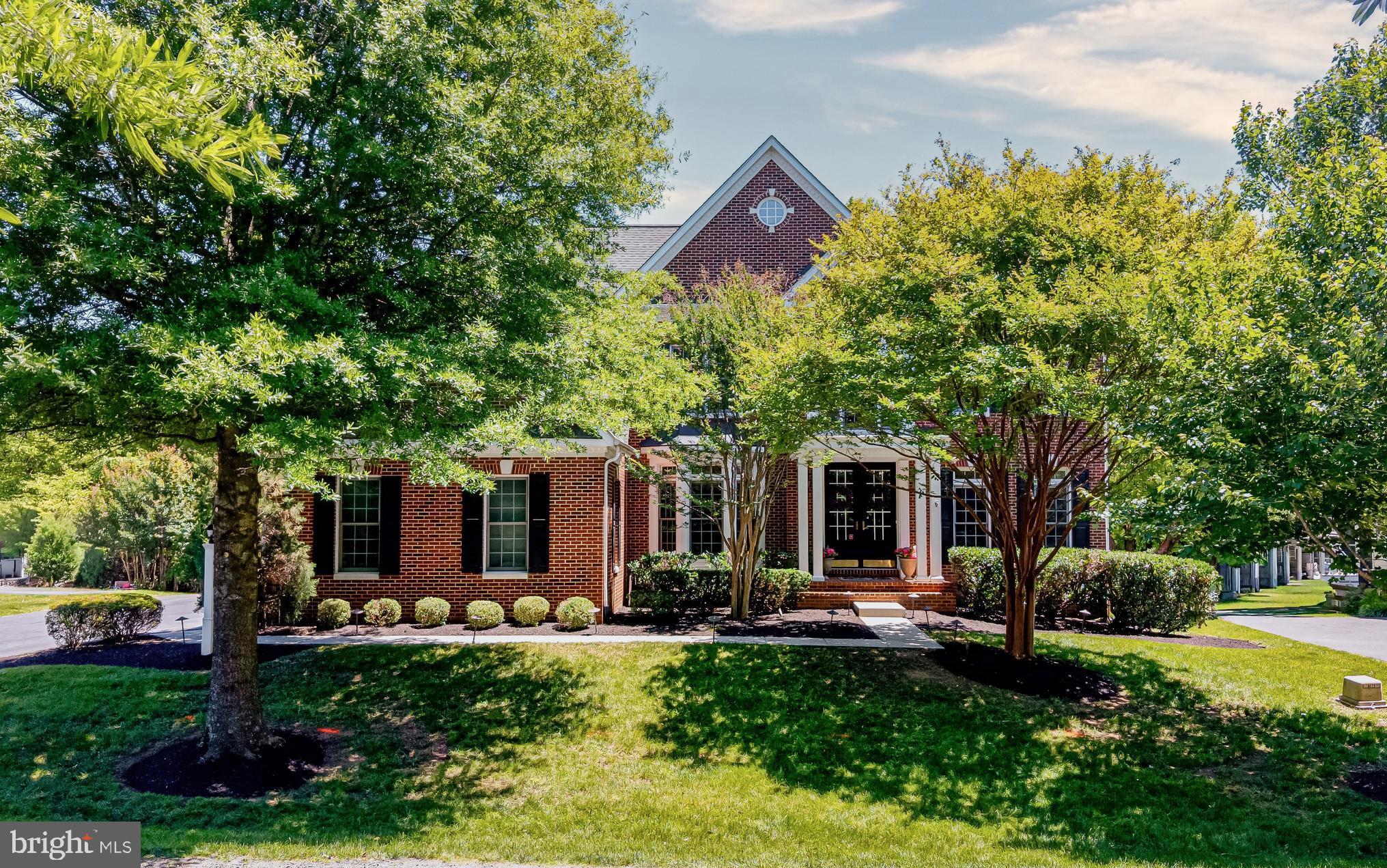 OPEN HOUSES THURSDAY JUNE 18TH 5-7PM, SATURDAY JUNE 20TH 12-2, & SUNDAY JUNE 21 1-3PM.
Welcome to this exceptional Browning model by Winchester Homes, beautifully sited on a private homesite backing to a mature tree preserve in sought-after Lenah Run. Blending timeless elegance with modern comfort, this residence offers refined living spaces, thoughtful upgrades, and serene outdoor surroundings.
Upon entry, you are welcomed by rich hardwood flooring that flows throughout the main level, complemented by custom paint, detailed trim work, and upscale designer lighting. The formal living room is enhanced by sophisticated shiplap accents, while the adjacent dining room showcases elegant textured wall coverings, creating a warm and inviting setting for entertaining. Expansive windows throughout these formal spaces frame picturesque views of the lush landscape and fill the home with natural light. Just off the formal living room resides the home office, featuring French doors for quiet study, beautiful trim and expansive windows which allow fabulous views of the rear grounds.
At the heart of the home, the open-concept design seamlessly connects the family room, gourmet kitchen, sunroom, and casual dining area. The family room is anchored by a striking brick fireplace with a wood-burning insert, flanked by large windows adorned with plantation shutters. The beautifully updated kitchen features dove-white cabinetry with extensive trim detailing, a substantial center island, granite countertops, stainless steel appliances, a stylish tile backsplash, and designer lighting that elevates the space. Just beyond, the sunroom extension provides a tranquil retreat—perfect for morning coffee, quiet reading, or simply enjoying the surrounding natural beauty through walls of glass.
Outdoor living is equally impressive. Step out to the private backyard, then descend to the spacious two-level paver patio nestled among mature landscaping. Whether hosting gatherings or enjoying a peaceful evening outdoors, these inviting spaces offer a seamless connection to nature.
The fully finished lower level expands the home’s versatility with a dedicated theater room, wet bar, TV/gaming area, home gym, abundant storage, and a full bath—ideal for recreation, entertaining, and everyday living.
Upstairs, hardwood flooring continues throughout the bedroom level hallway. The luxurious primary suite serves as a private sanctuary, featuring an elegant sitting area defined by architectural columns, a tray ceiling, a spacious walk-in closet, and a spa-inspired bath complete with a soaking tub, updated shower surround, private water closet, and granite-topped vanity. Three additional bedrooms offer comfortable accommodations, including a shared buddy bath and a private en-suite bath.
Additional highlights include an upper-level laundry room, a three-car attached garage with built-in shelving, seasonal storage, a tankless water heater, two newer HVAC systems, fresh paint in select areas, and roof replacement completed in 2017, irrigation system for the grounds so you'll always have green grass.
Ideally located just minutes from the Lenah Run Community Pool featuring the Froggers Swim Team, this home offers access to exceptional neighborhood amenities while maintaining a peaceful, nature-filled setting. Here, residents enjoy the perfect balance of tranquility and convenience—close to everyday necessities, yet surrounded by the beauty and serenity of the countryside.