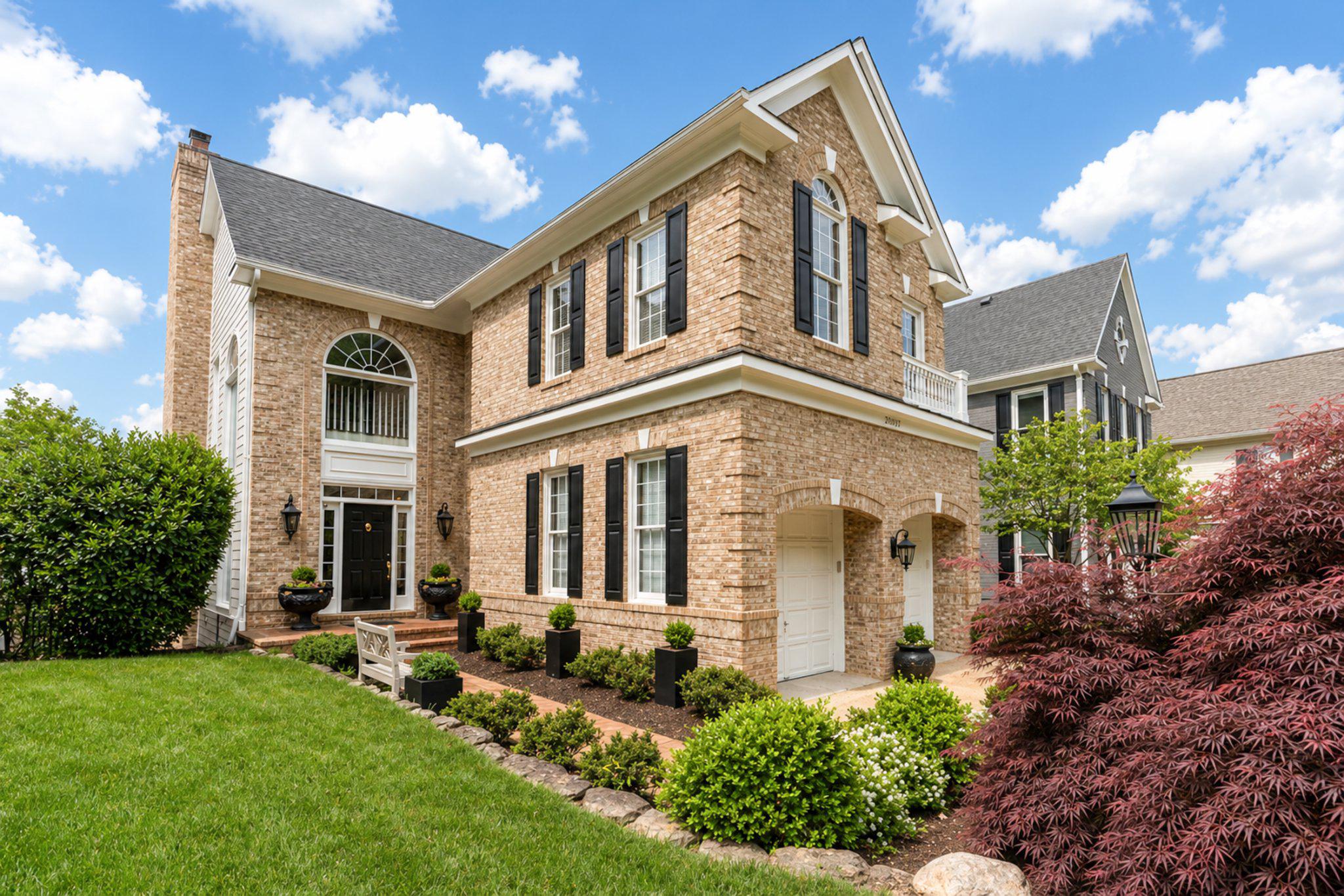 Watermark Place is one of Lowes Island’s most established and desirable neighborhoods. This home enjoys a prime position along the fifth fairway of Trump National Golf Club’s Riverview Course, delivering unobstructed golf course views and seasonal views of the Potomac River.

Spanning over 4,800 finished square feet, this single-family residence features five bedrooms and four-and-a-half bathrooms. Three bedrooms (two ensuite) occupy the upper level, while two additional bedrooms on the lower level provide excellent flexibility for guests, an au pair, or multi-generational living.

Bespoke craftsmanship and a modern floor plan define the main level, creating a seamless connection from the foyer’s graceful, curved staircase through the dining room, kitchen, and family room. A thoughtful rear bump-out and expansive deck extend the living space while capturing the best of the scenic views. Centered around a gas fireplace, the family room serves as a comfortable and versatile gathering spot. A dedicated home office showcases custom built-in cabinetry, offering an ideal work-from-home environment, complemented by an updated mudroom and powder room. 

At the heart of the home, the gourmet kitchen impresses with high-end Miele and Thermador appliances, including a gas range with griddle, paneled refrigerator, and two sinks. A generous 14-foot marble island anchors the space, paired with elegant glass-front upper cabinetry, built-in pantries, beverage refrigerator, and a convenient pass-through to the dining room featuring a wet bar, refrigeration drawers, and wine refrigerators. Reconfigured drawers and thoughtful storage solutions further enhance both functionality and style throughout.

The primary suite provides a serene retreat with a cathedral ceiling, ample seating options, sweeping golf course views, a fully updated spa-inspired bathroom, and an expanded walk-in closet with custom built-ins. There are two additional upper-level bedrooms, one of which is an en-suite and opens to a charming Juliet balcony. Residents will also appreciate the well-appointed upper-level laundry room, complete with cabinetry, folding space, and a utility sink.

The lower level offers two bedrooms, both with ample closet space, an updated full bathroom, a family room, game area, a generously sized storage room, utilities and access to the patio. 

A two-car garage offers built-in storage cabinetry and shelving with space for cars and/or golf carts. The driveway allows for accommodation of two additional cars.

Outside, a spacious deck and patio create an inviting space for relaxing or entertaining while overlooking the fairway with seasonal views of the Potomac River. All lawn care is handled by Cascades Community Association.

Recent updates throughout the home reflect meticulous care, including two new HVAC systems, newer roof, two new gas fireplaces, new Hardieplank siding on portions of the home, interior paint, new carpet on the lower-level stairs, freshly polished hardwood floors, new LVP flooring on the lower level, and renovated bathrooms. Additional conveniences include a central vacuum system.

Ideally positioned in one of Lowes Island’s most consistently sought-after communities, this home delivers an exceptional combination of prime location, beautiful views, meaningful updates, and generous living space.